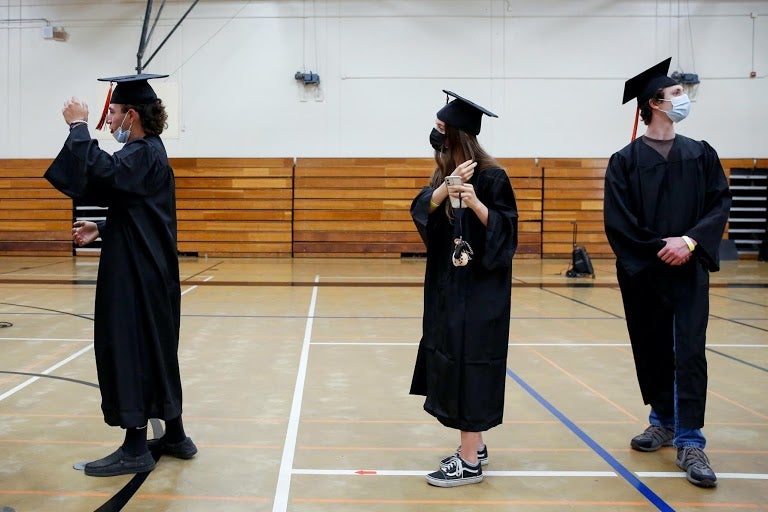 Rosales wears her graduation cap and gown