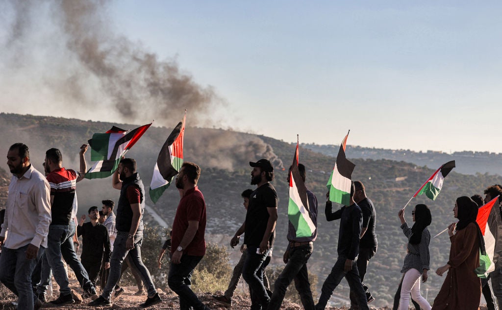 Palestinian protesters gather during a demonstration against the Israeli outpost of Eviatar, in the town of Beita, near the occupied West Bank city of Nablus, on 6 July