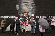 ‘A show of support’: Hundreds descend on defaced Marcus Rashford mural to decry racist graffiti