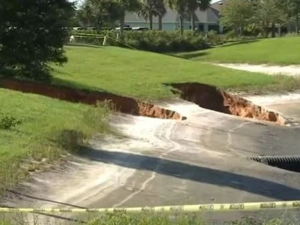 Two of three sinkholes that opened up in The Villages in Florida on Monday.