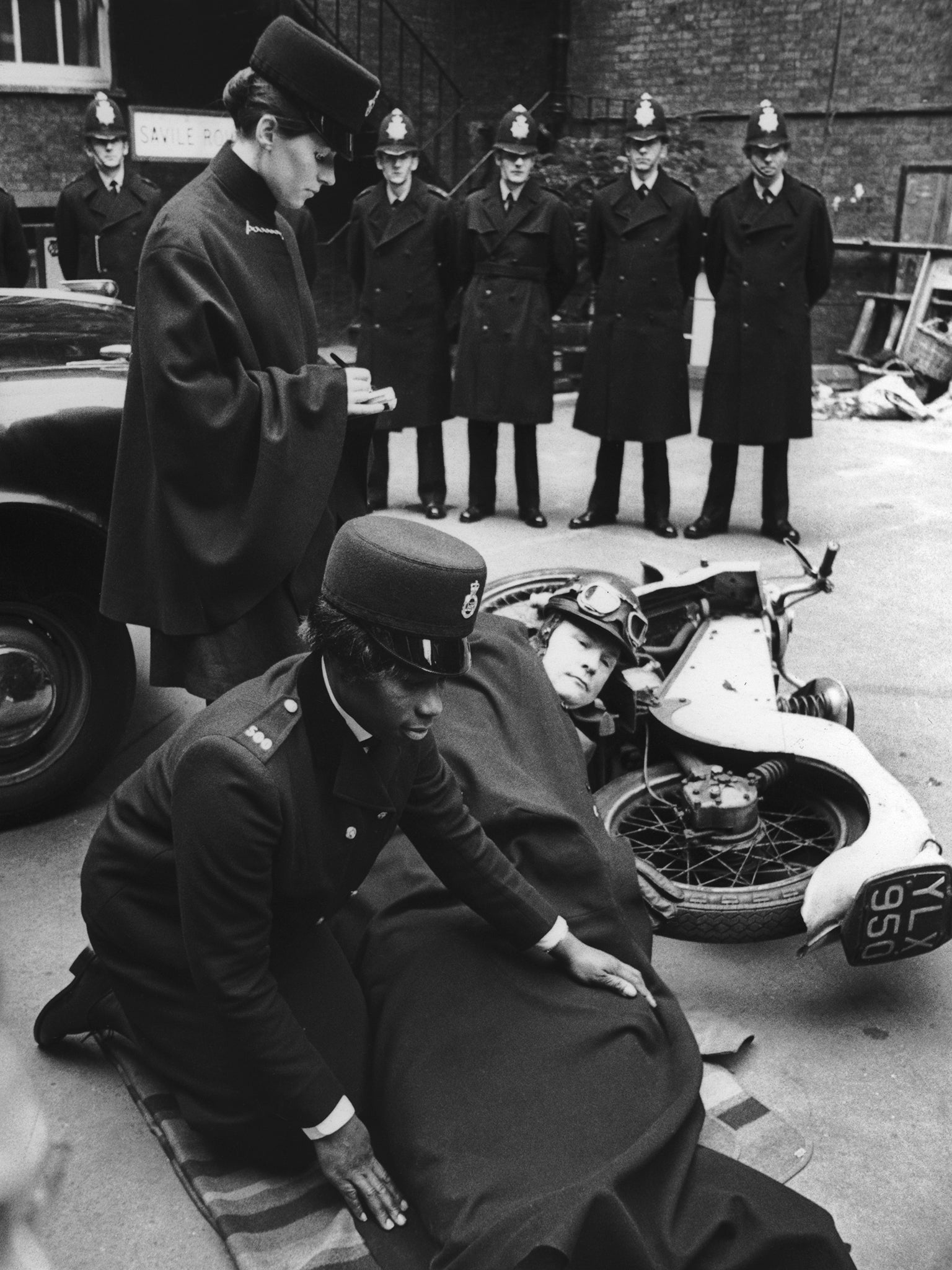 Allen and fellow trainee policewoman Carolyn Marriage learn how to deal with a motorcycle accident