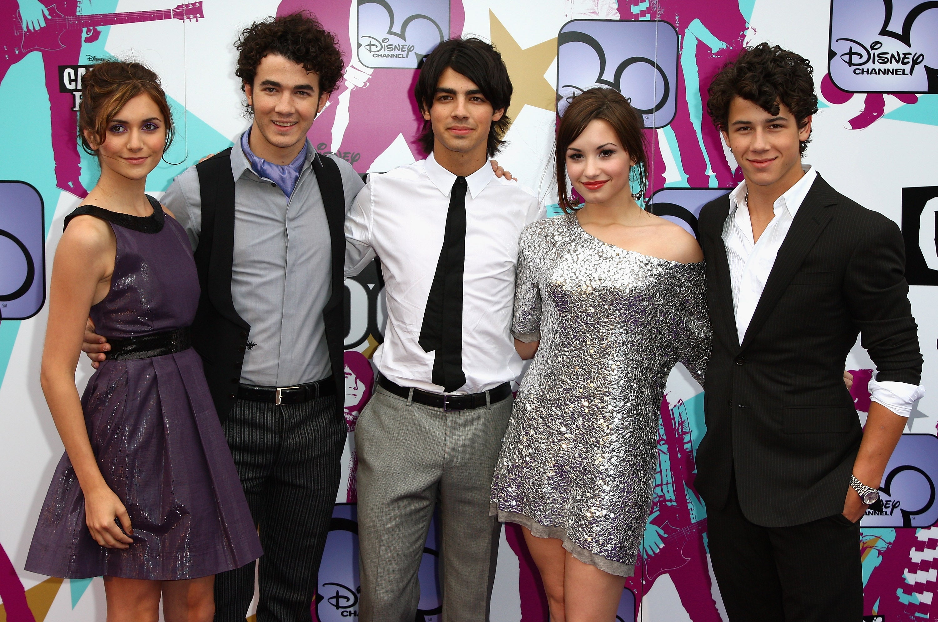 Alyson Stoner (left) and Demi Lovato with Kevin, Joe and Nick Jonas