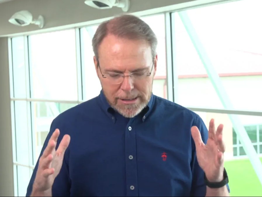 Pastor Bruce Wesley of Clear Creek Community Church prays for God to stop the coronavirus pandemic after more than 125 people contract the virus following his church’s mask-optional student summer camp.