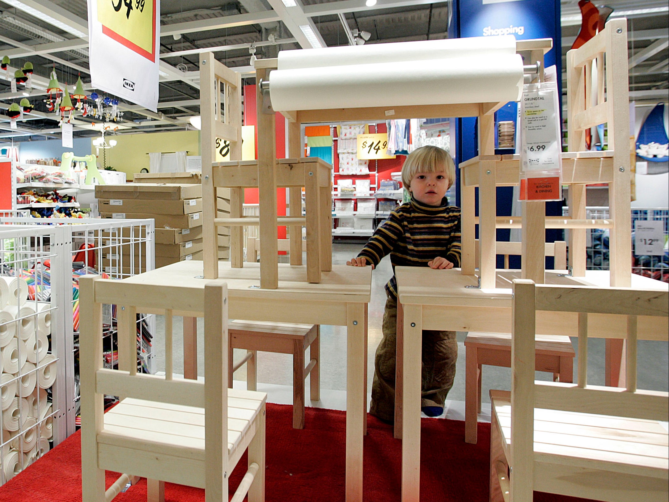 A small boy plays in the juvenile furniture section of a branch of IKEA in Paramus, New Jersey
