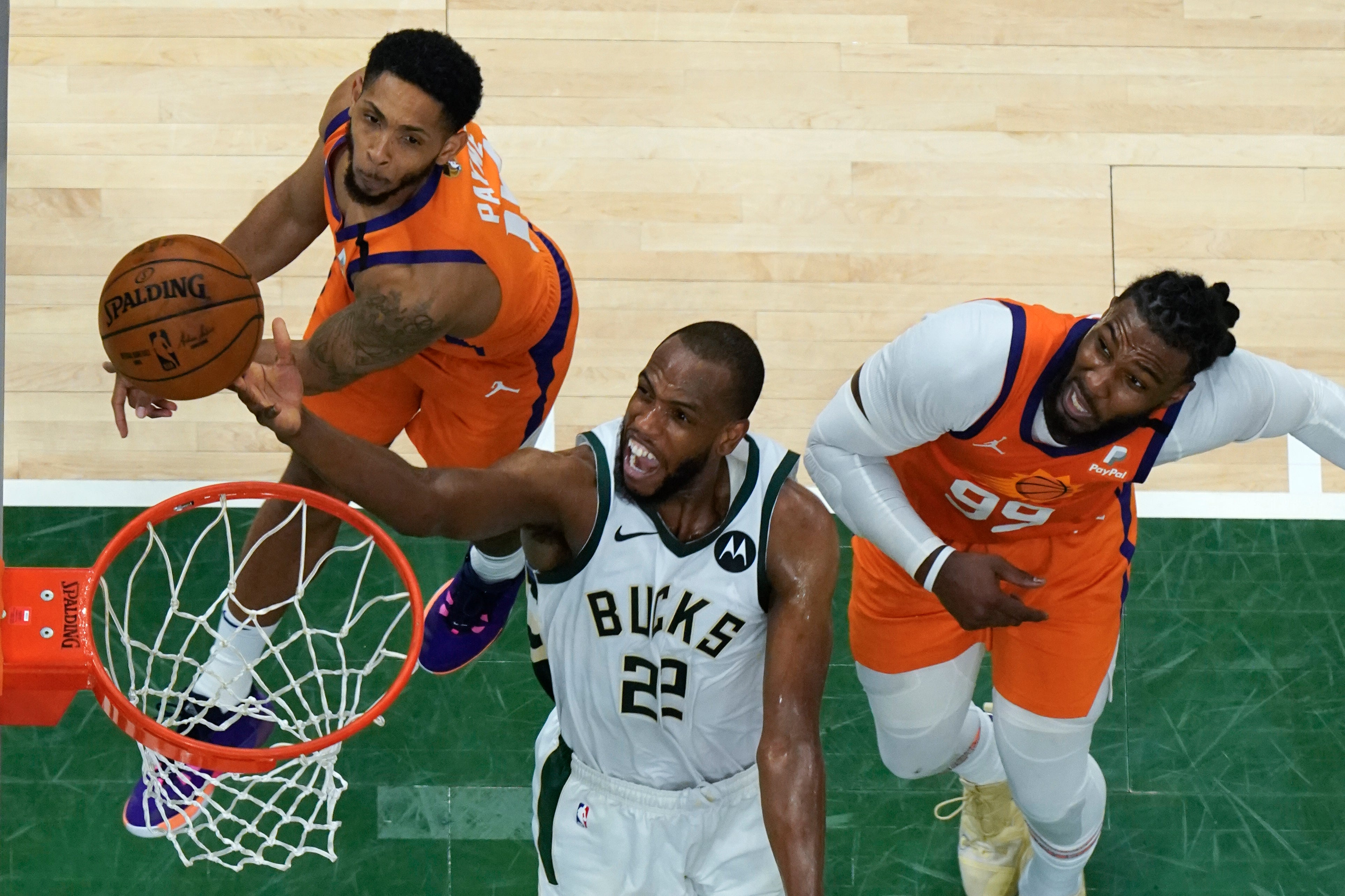 Milwaukee Bucks forward Khris Middleton (22) drives to the basket during their clash with the Phoenix Suns