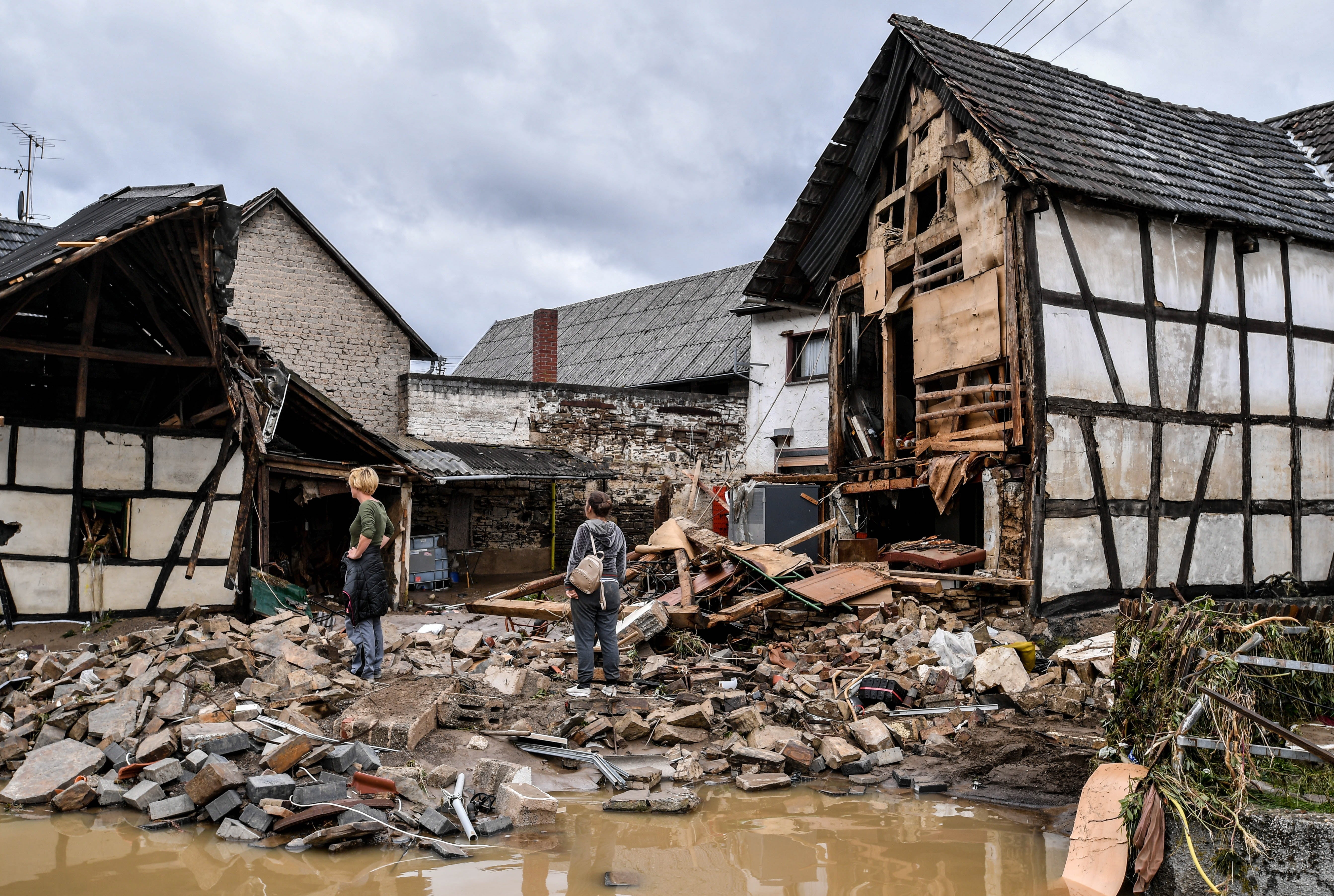 Local residents inspect the damage in Schuld