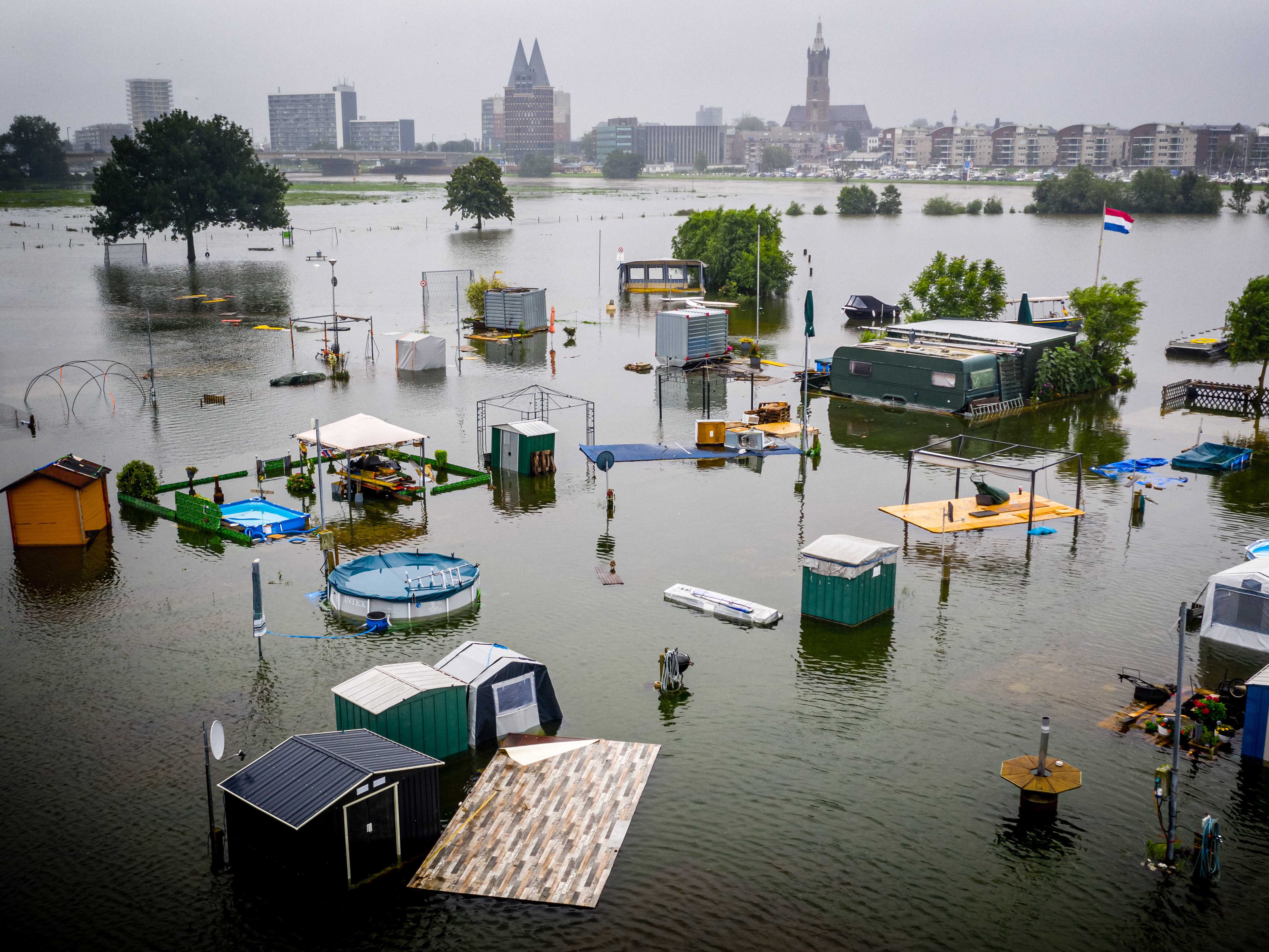 Image taken with a drone shows caravans and campers under water at the De Hatenboer campsite in Roermond