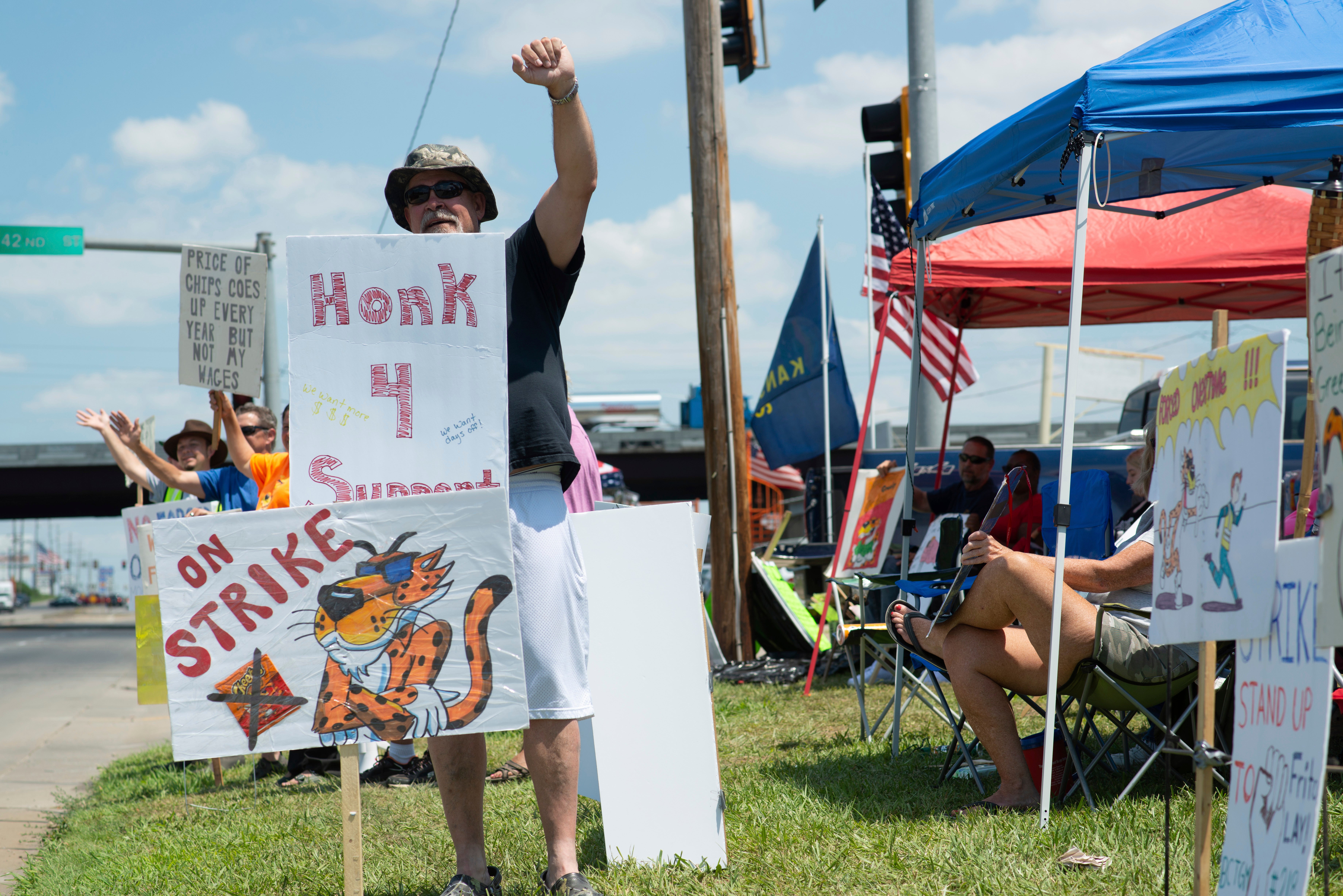 Ron Sadler, a 32-year employee at Frito-Lay’s facility in Topeka, Kansas, joins a union strike.