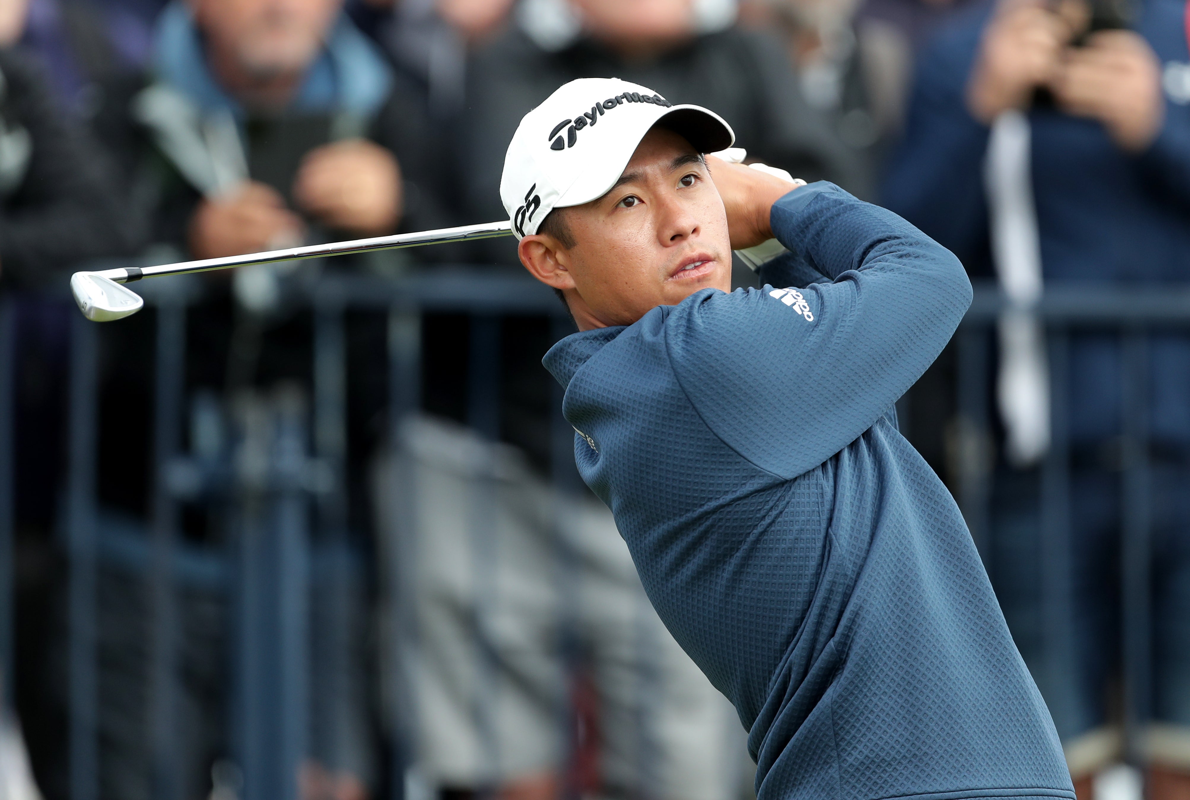 Colin Morikawa tees off with an iron