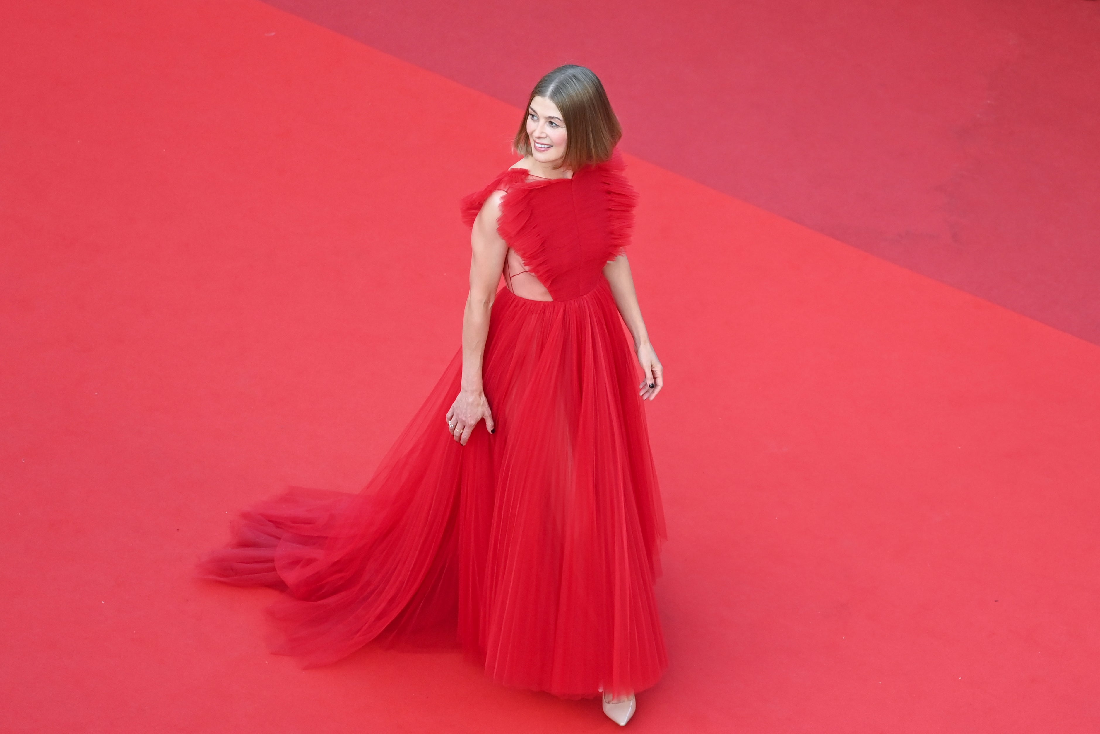 The British actor wore a crimson tulle gown by Dior for the closing ceremony of Cannes. The dress featured a full pleated skirt and a ruffled bodice with sheer cutouts.