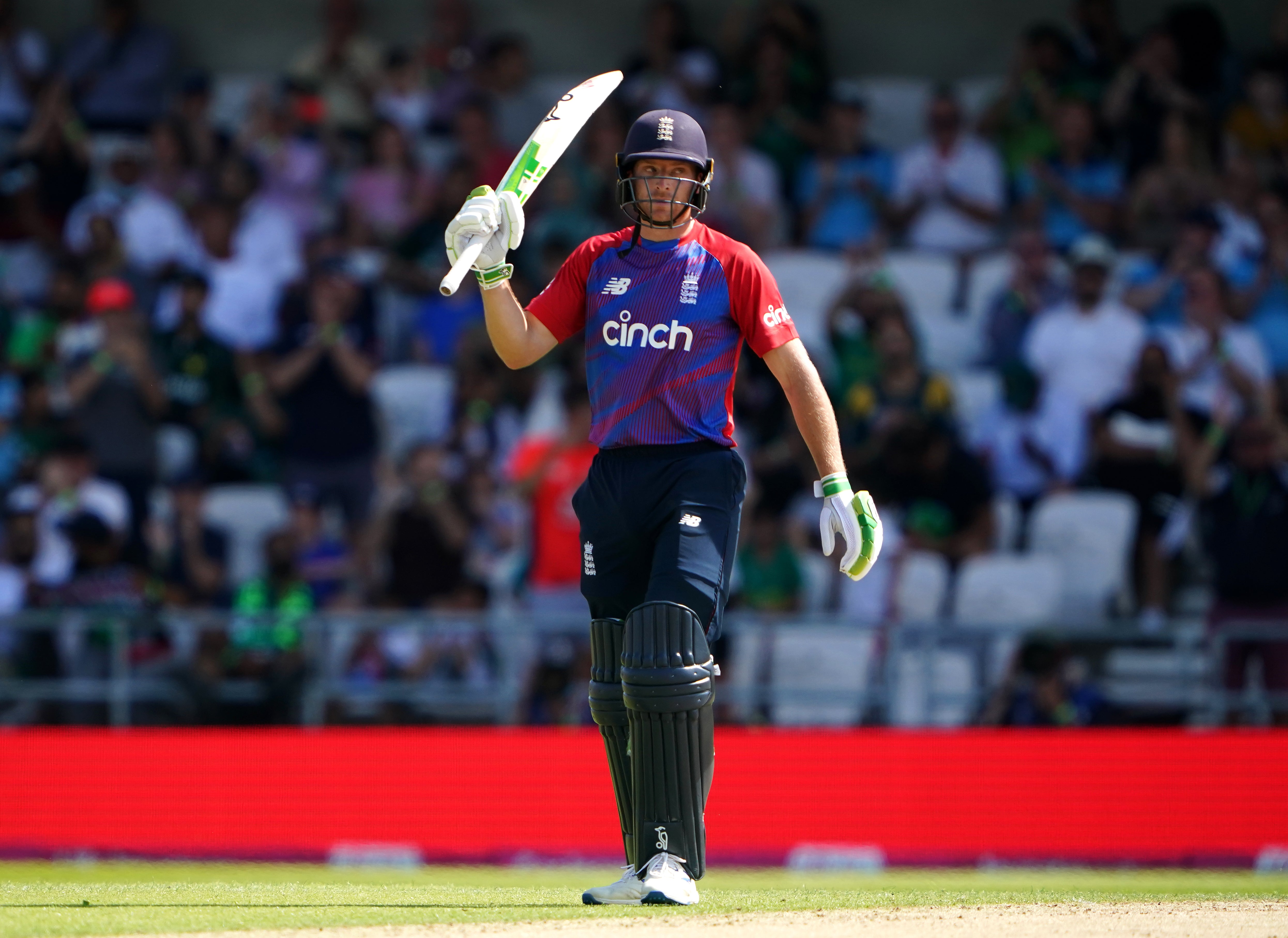 Jos Buttler celebrates reaching his half-century