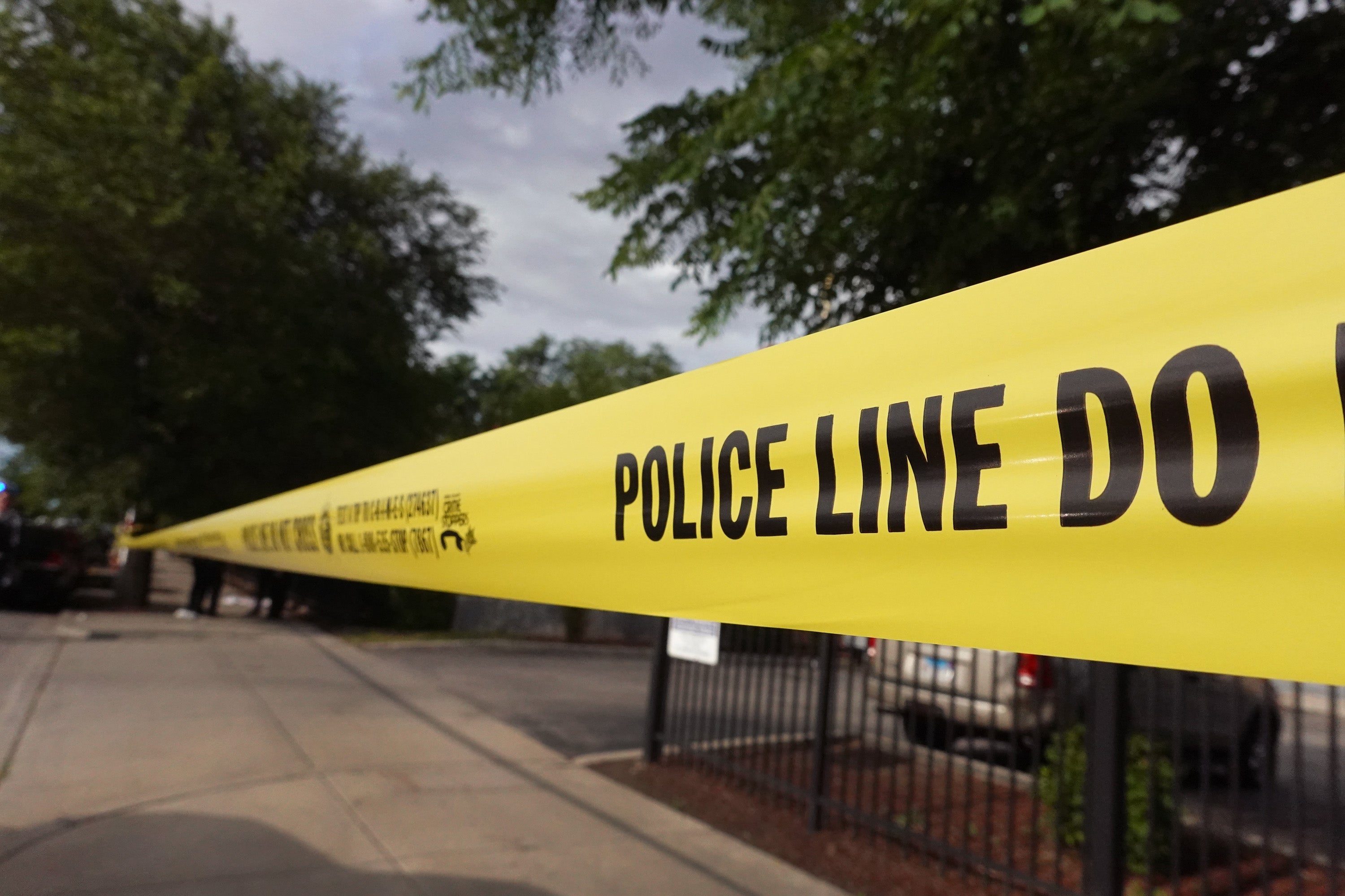 File: Police tape surrounds a crime scene where three people were shot on 23 June, 2021 in Chicago