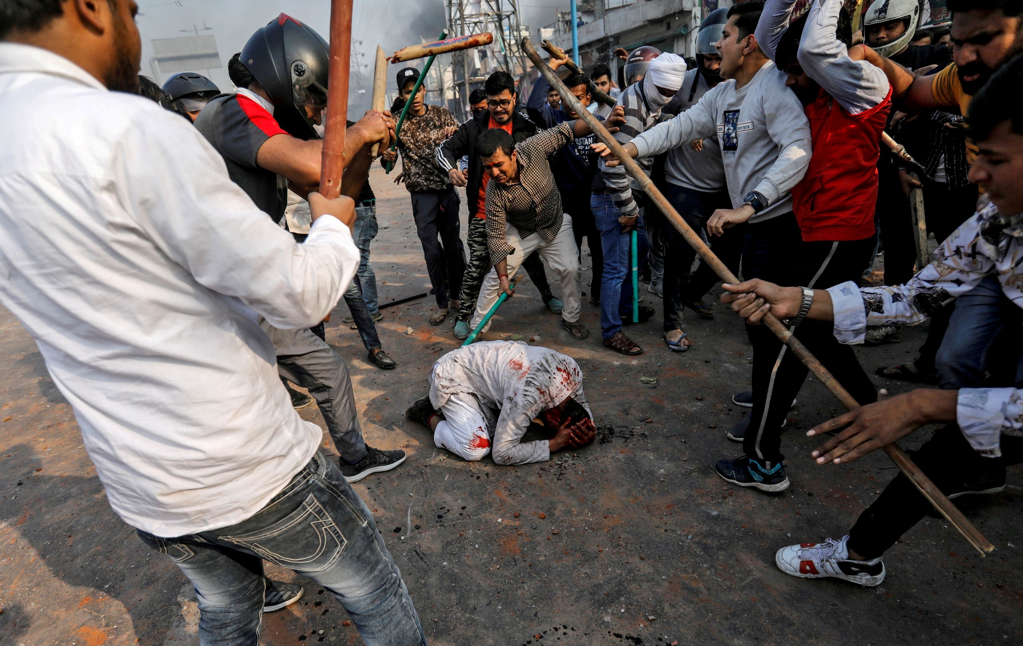 A group of men chanting pro-Hindu slogans beat Mohammad Zubair, a Muslim, during protests sparked by a new citizenship law in New Delhi, India, in 2020