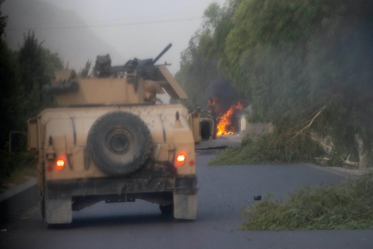 Humvees that belong to Afghan special forces are seen destroyed during heavy clashes with the Taliban during the rescue mission of a police officer besieged at a check post in Kandahar province, Afghanistan