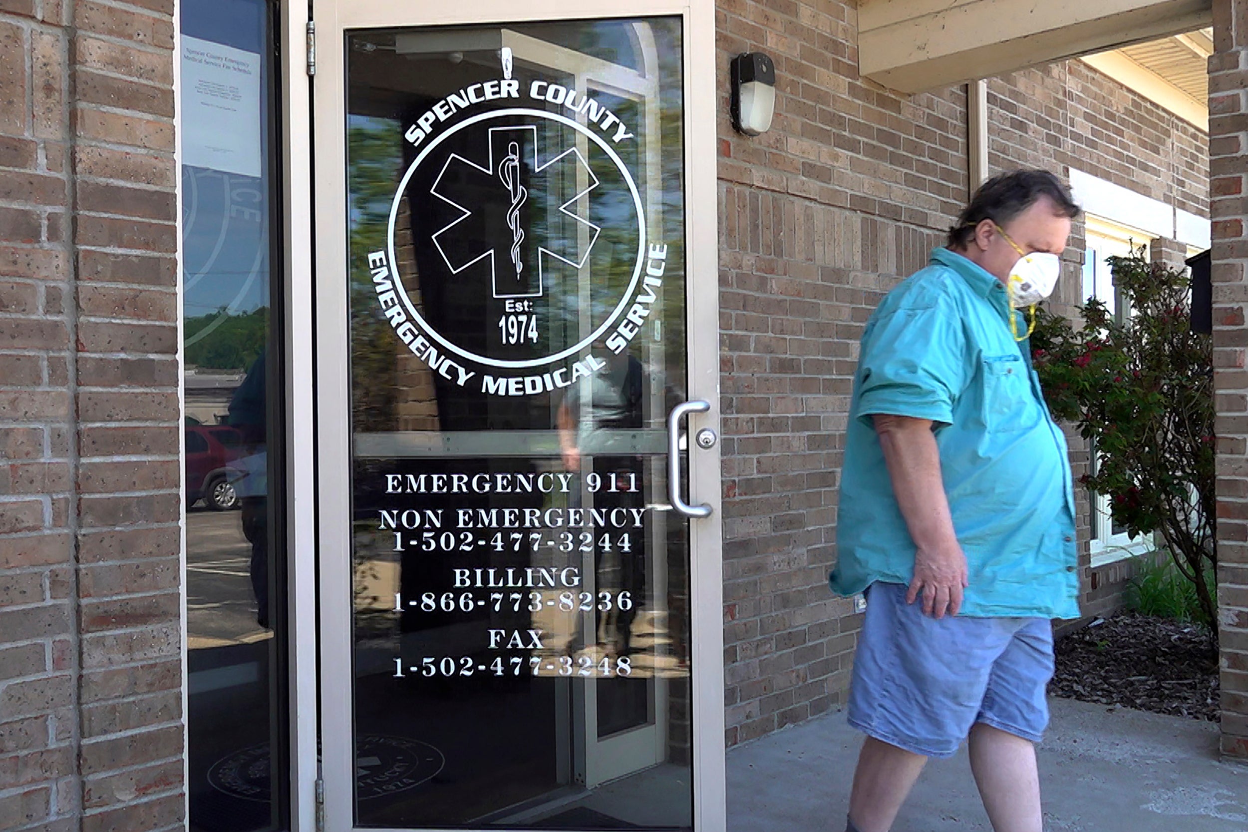 A man leaves a clinic after receiving a dose of the COVID-19 vaccine in Taylorsville, Kentucky