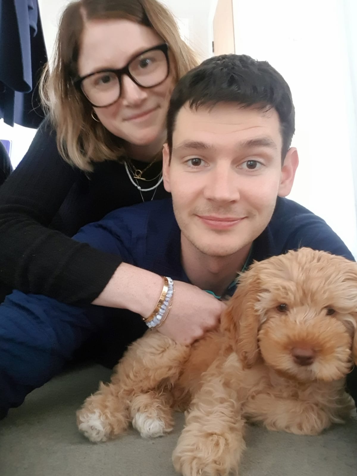 Sam Sellers and Libby Barrett, 31 and 32, with their Australian Labradoodle Finn