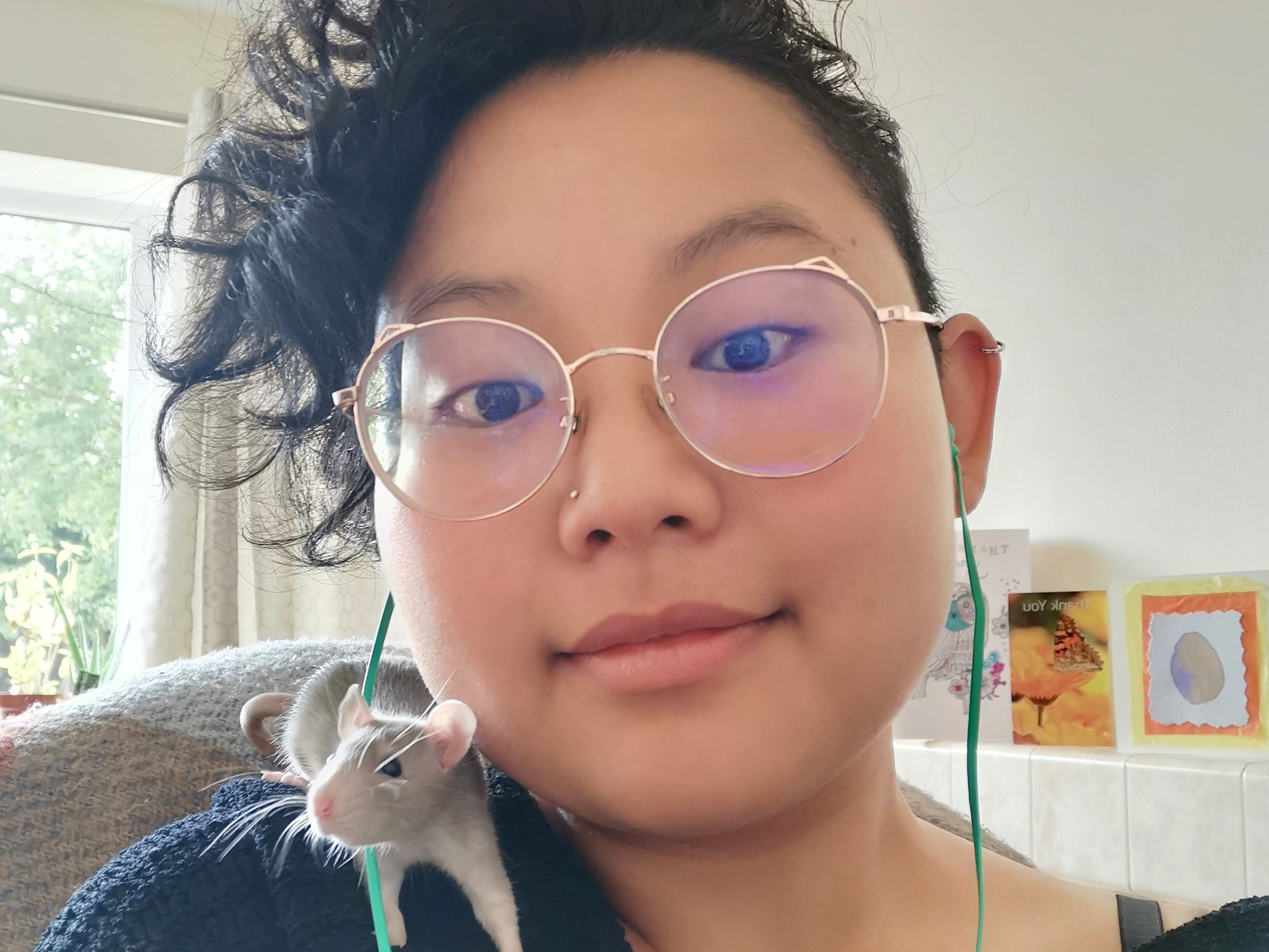 Deborah Tan with one of her three rats, Blossom, Bubbles and Buttercup