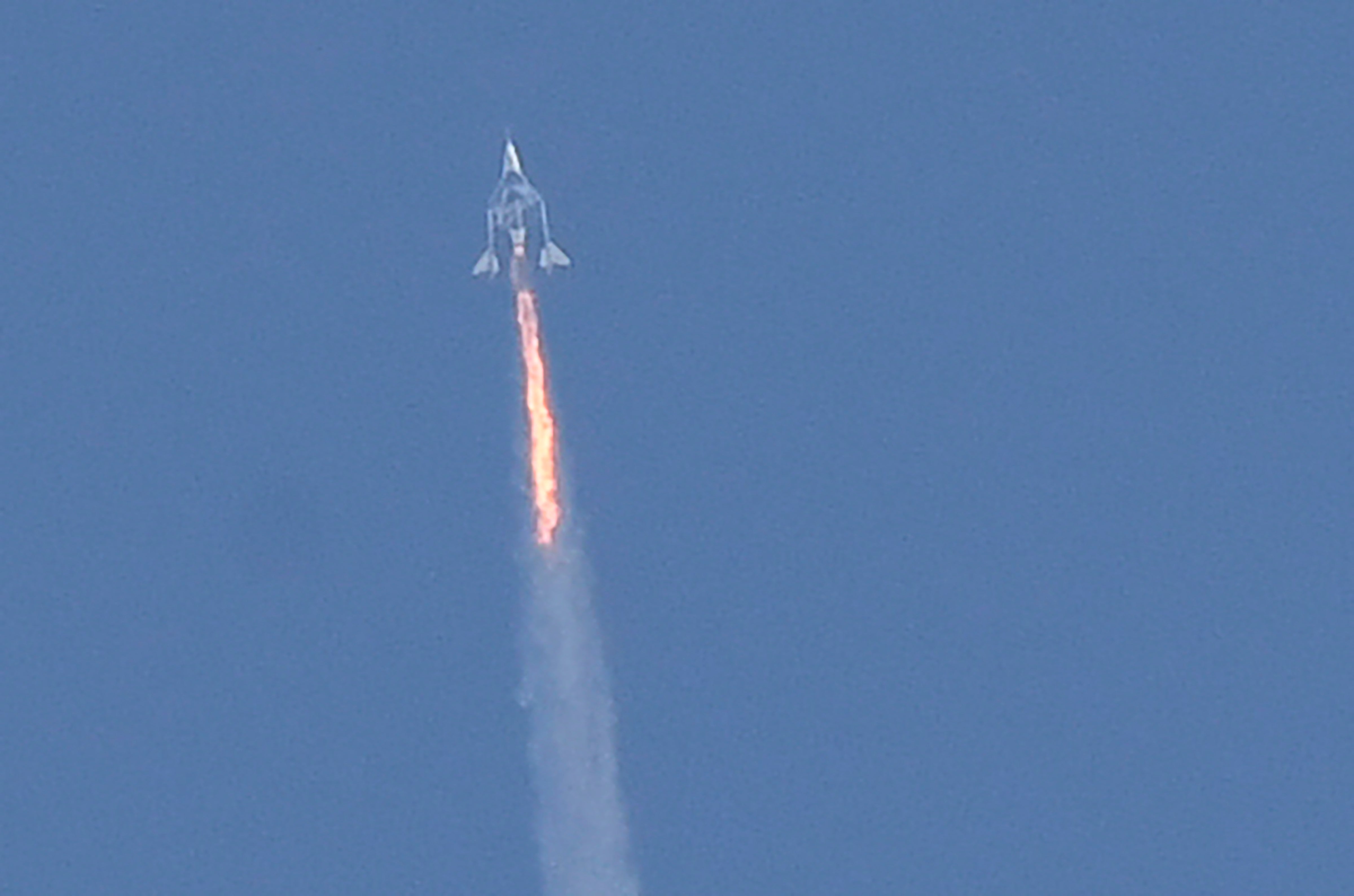 The Virgin Galactic SpaceShipTwo space plane Unity and mothership separate as they fly way above Spaceport America in New Mexico on July 11, 2021