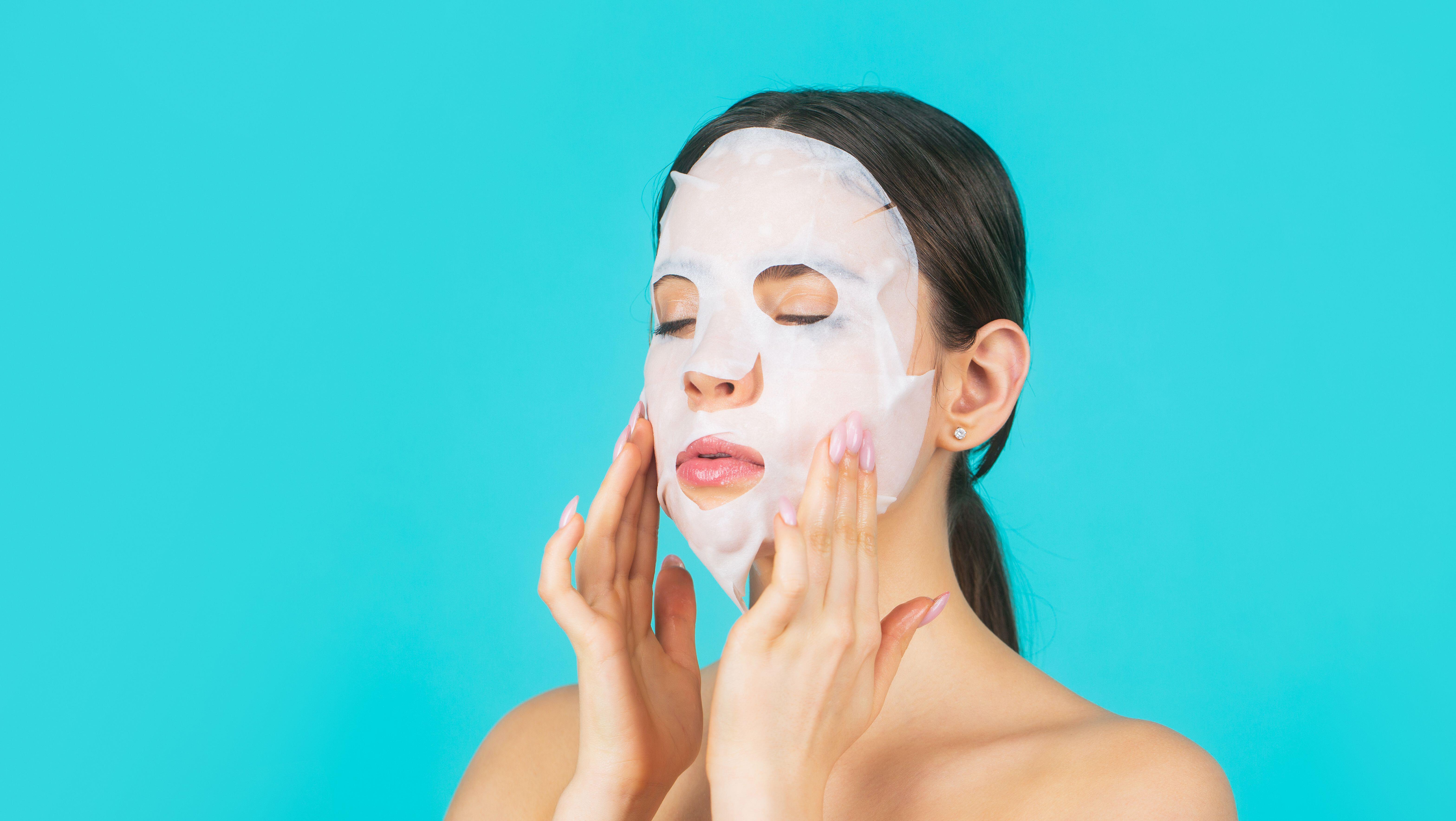 Woman wearing skincare sheet mask