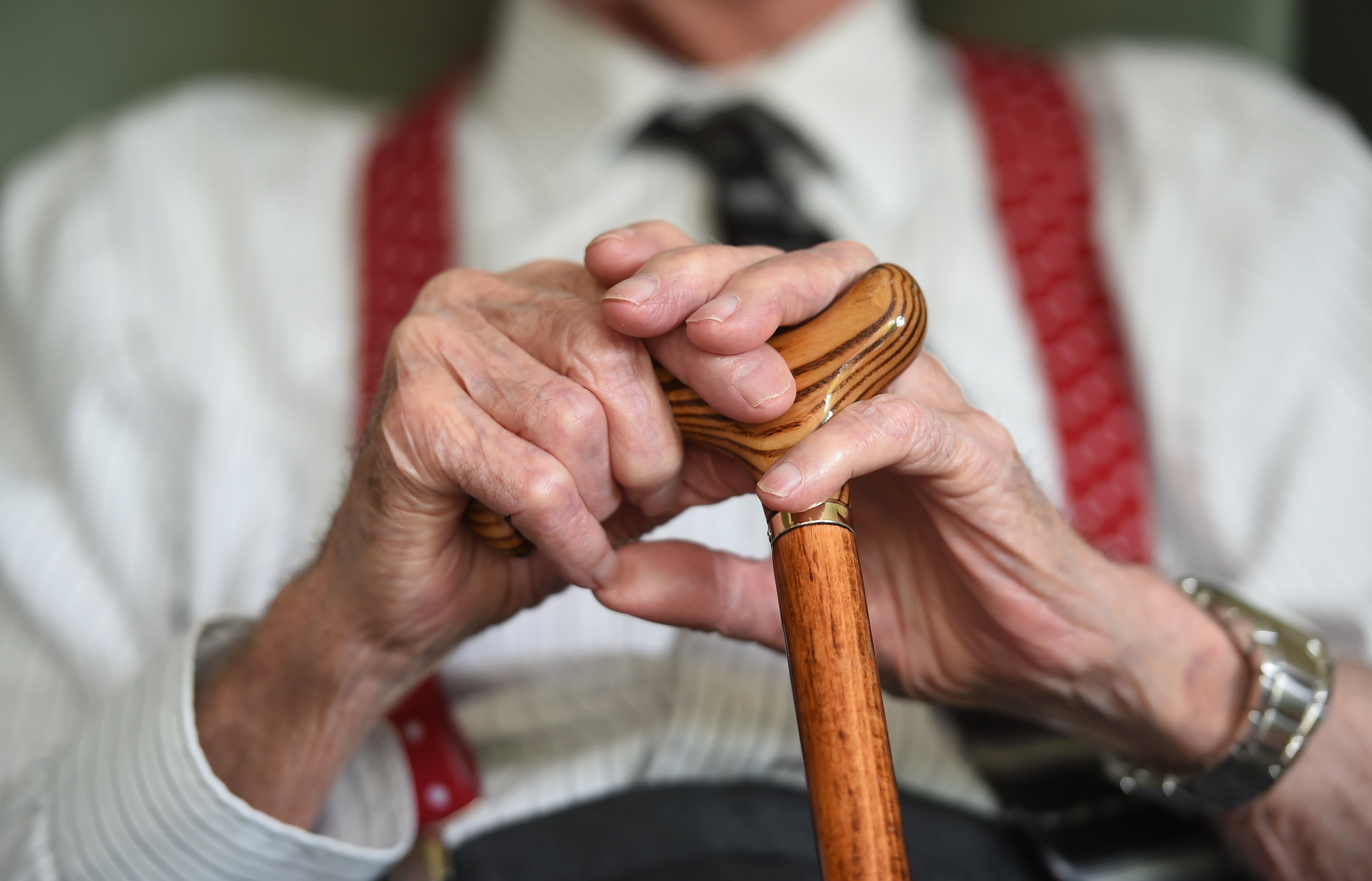 Elderly man with walking stick