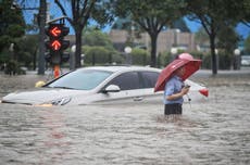 China floods: Horrifying footage shows flooded subway with neck-high water as 12 dead in Zhengzho