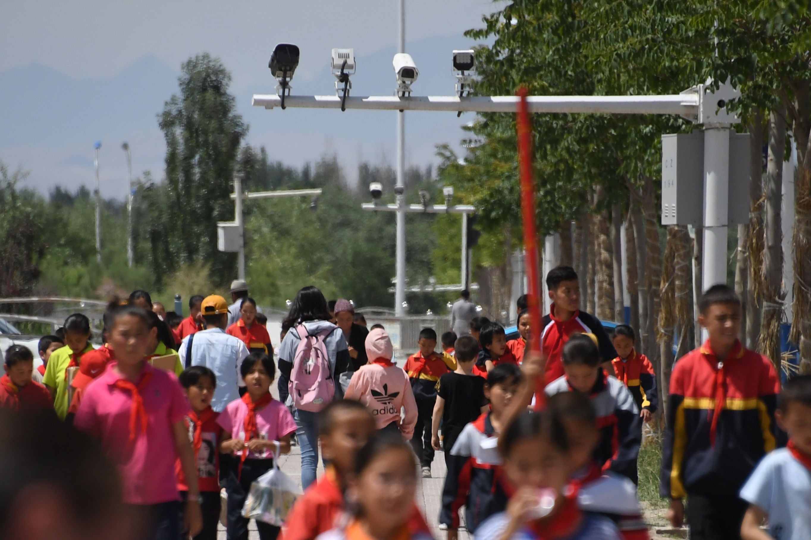 Cameras record schoolchildren in Xinjiang in China, the heavily policed region where Uighurs and other ethnic minorities face increasing pressure