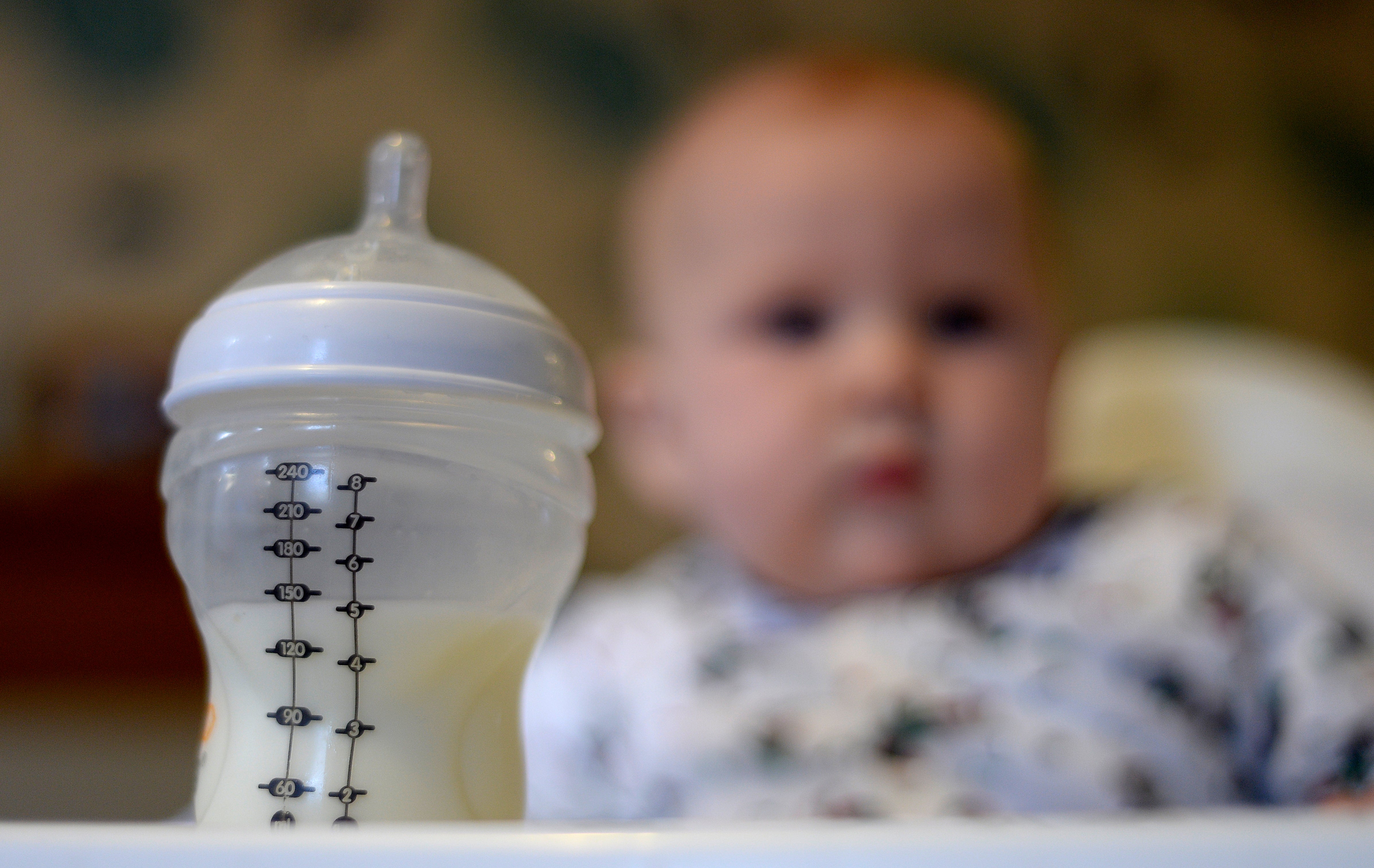 a baby with a bottle