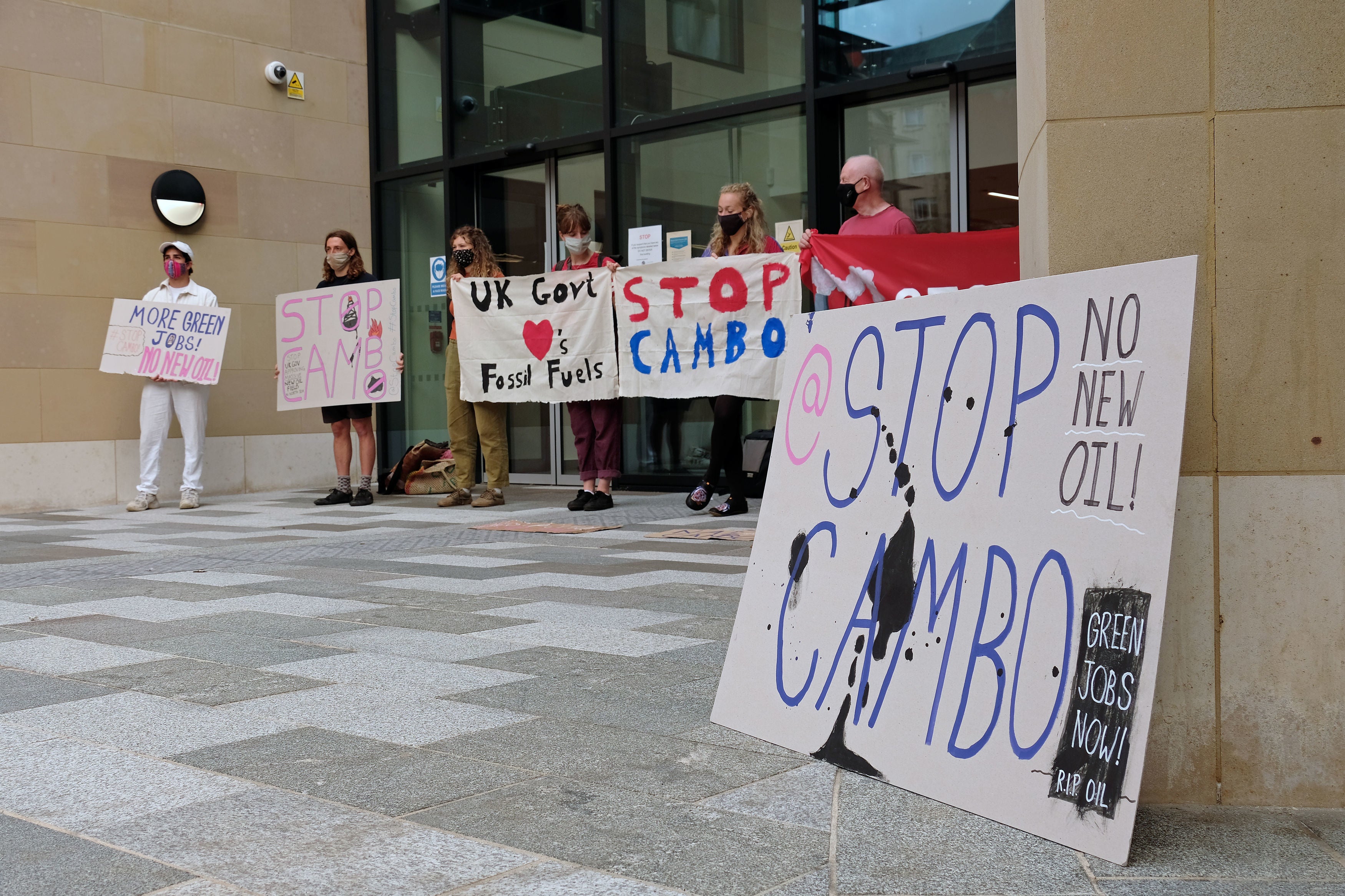 Climate change activists blocked the entrance to a new UK Government hub in Edinburgh to protest against the Cambo oil field’s approval