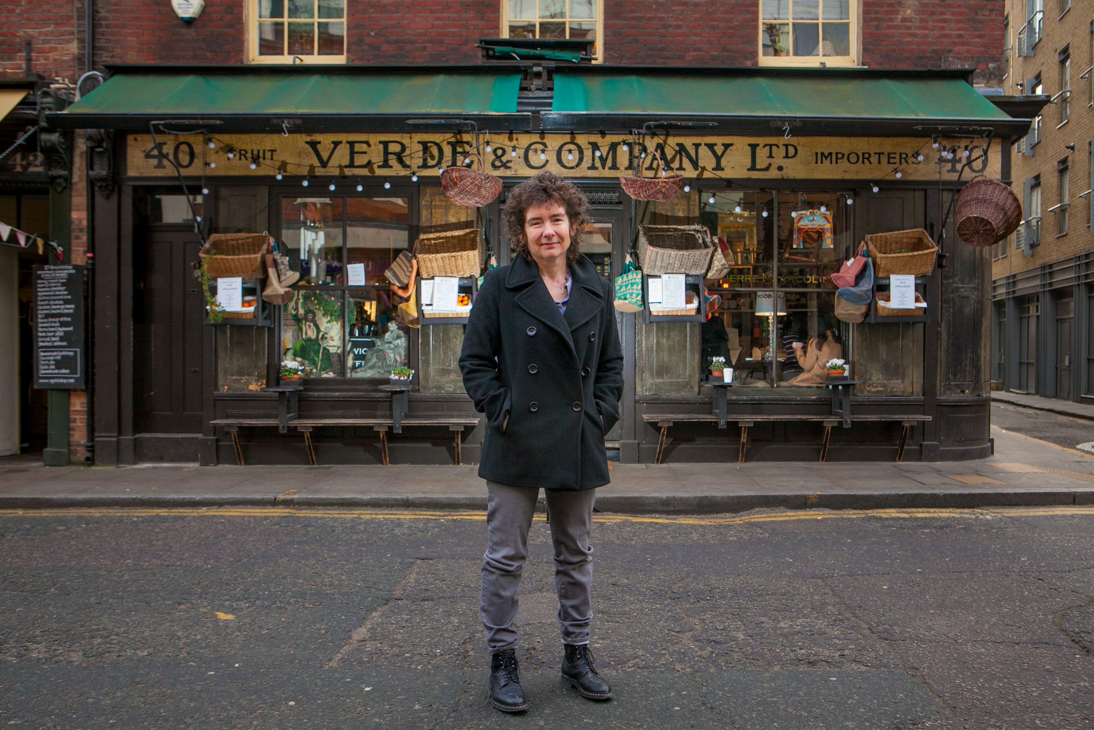 Winterson outside Verde & Company, her former grocer-cum-deli shop, on the ground floor of the derelict house in London’s Spitalfields that she renovated in 1994 and still owns