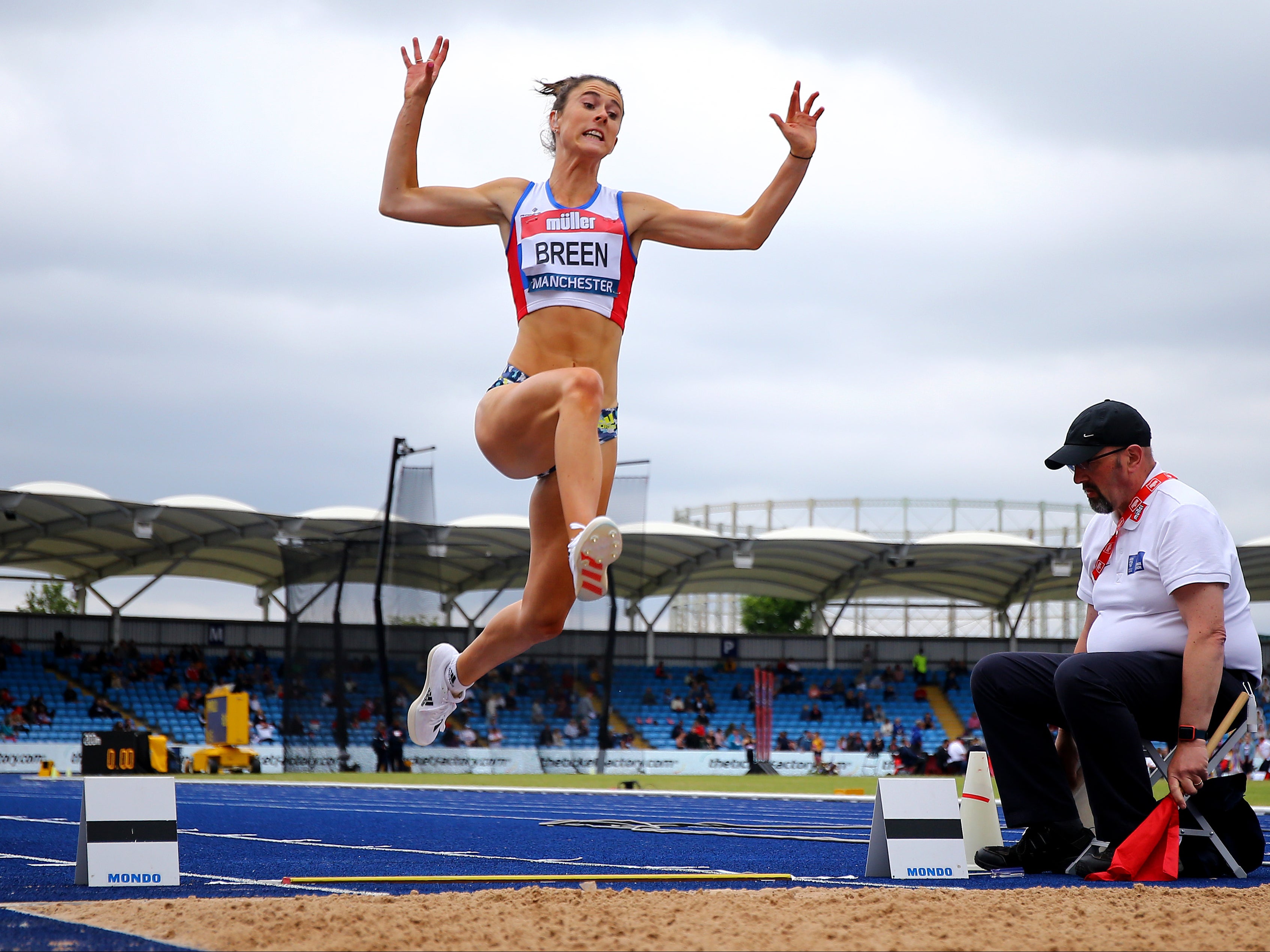 British Paralympian Olivia Breen performing a long jump