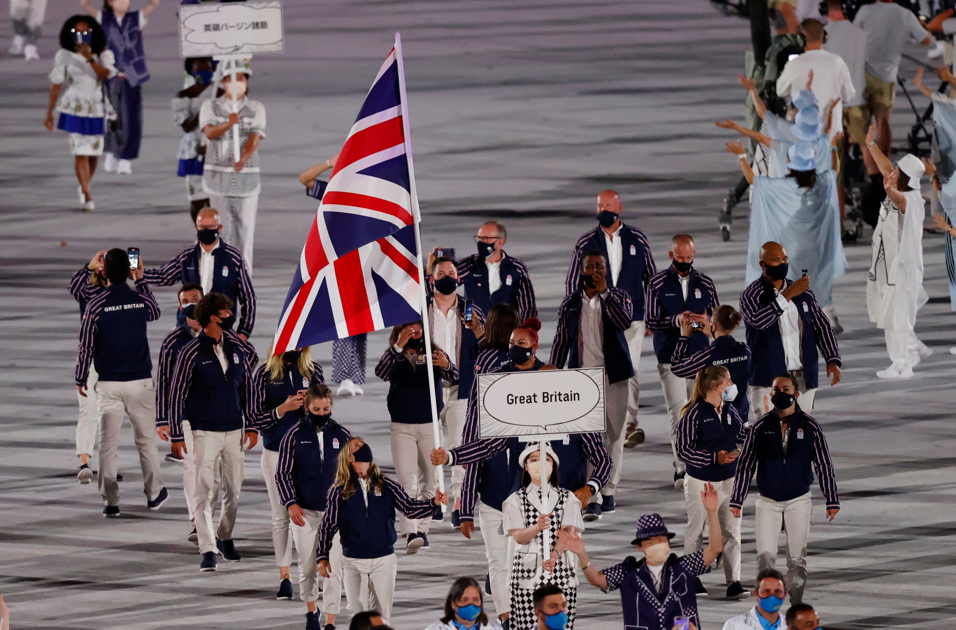 Flagbearer Mohamed Sbihi of Great Britain leads his country’s contingent of athletes during the opening ceremony