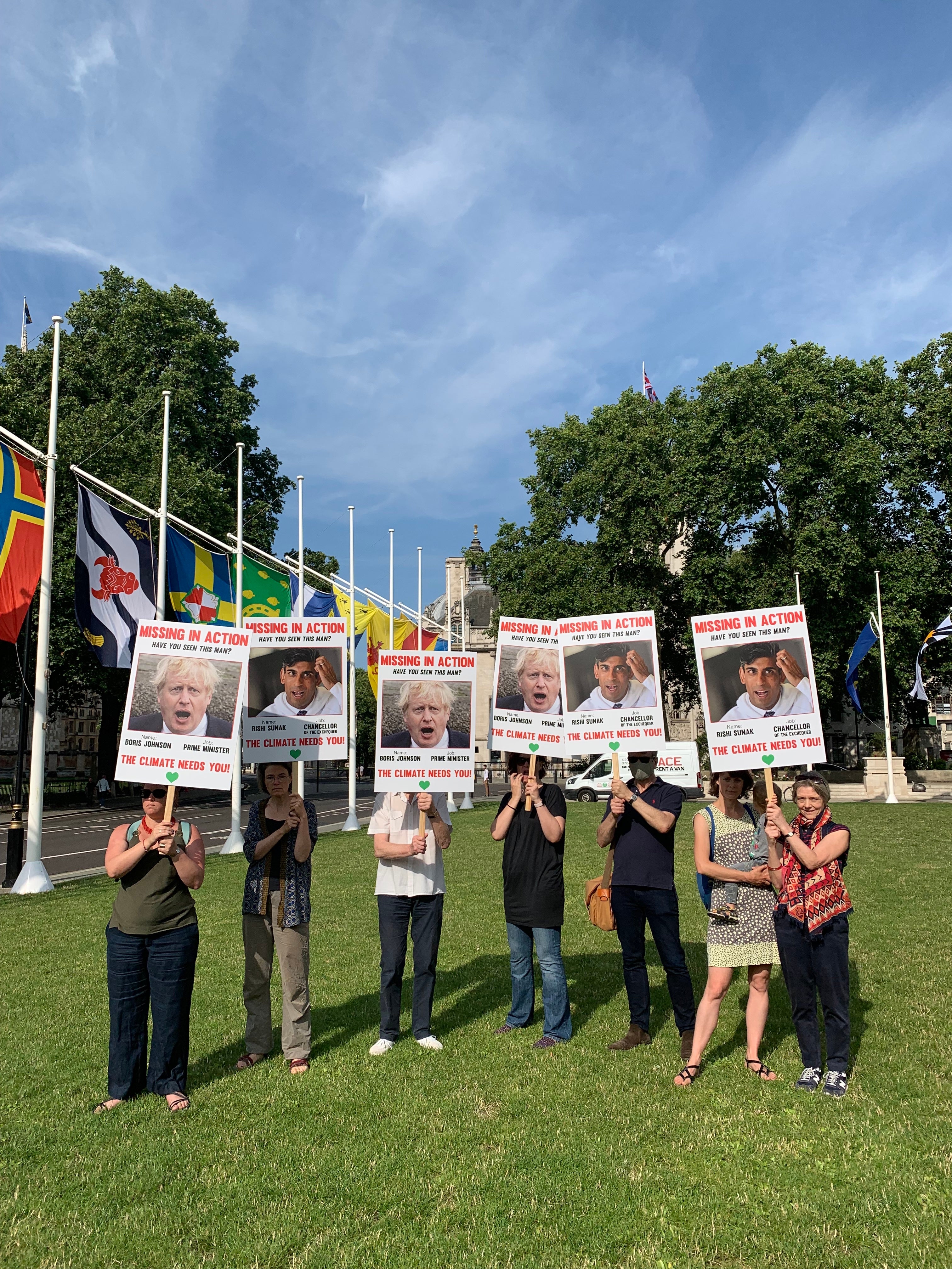 Placards questioning the whereabouts of Johnson and Sunak in the fight against climate change filled the patch of grass outside Westminster