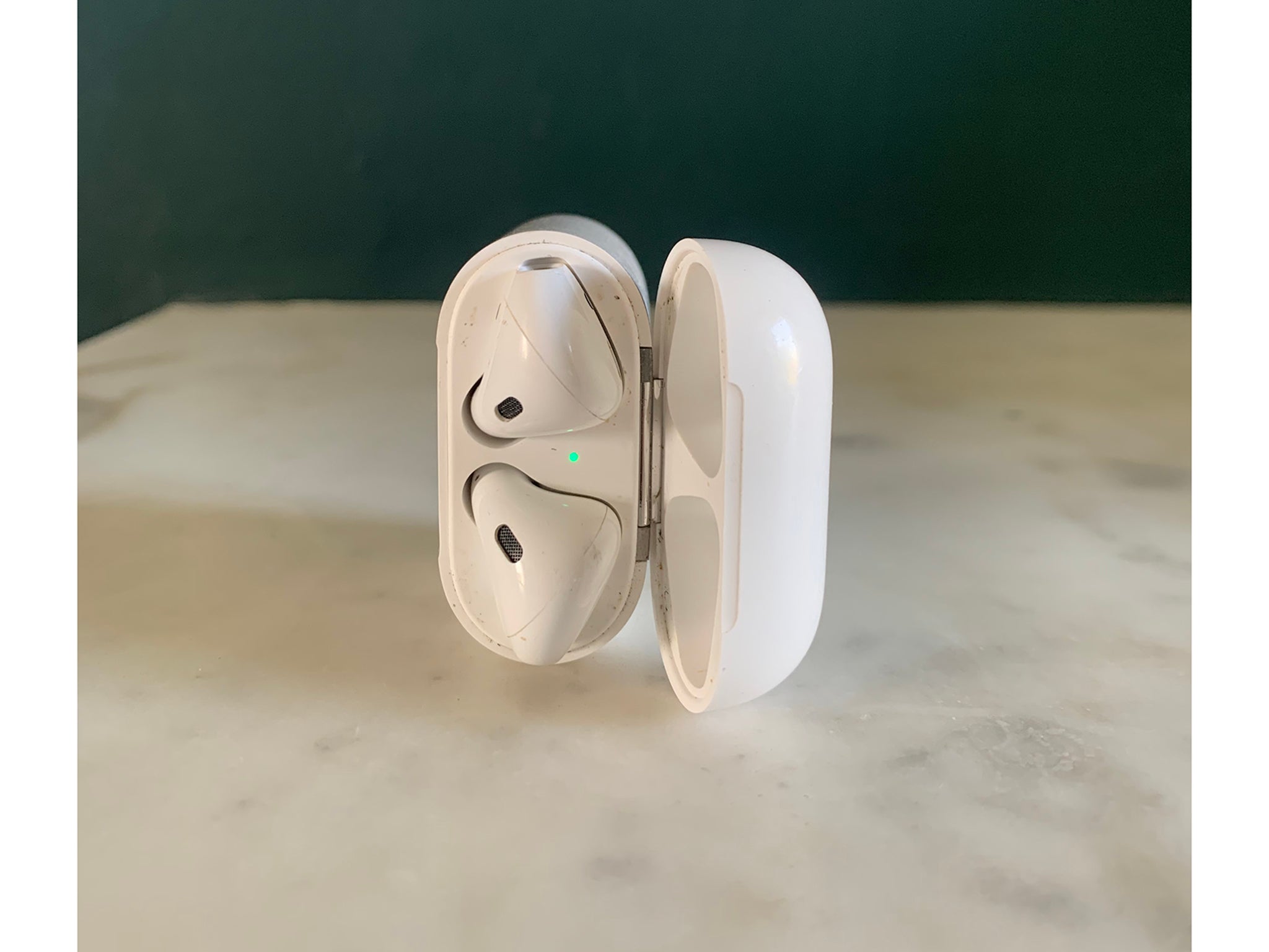 The Apple AirPods in their sleek charging case