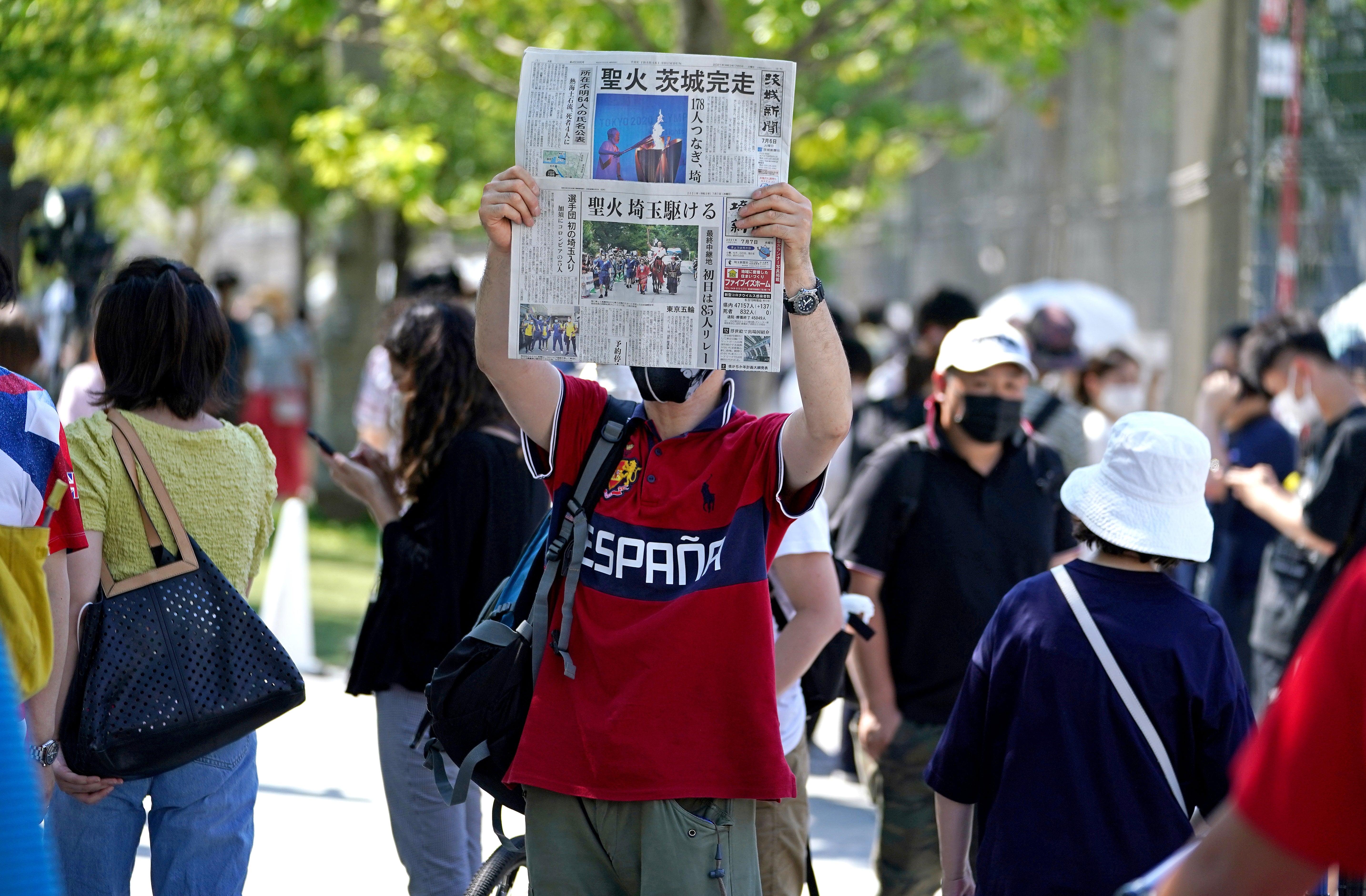 A newspaper is held up in protest outside the Olympic Stadium (Mike Egerton/PA)