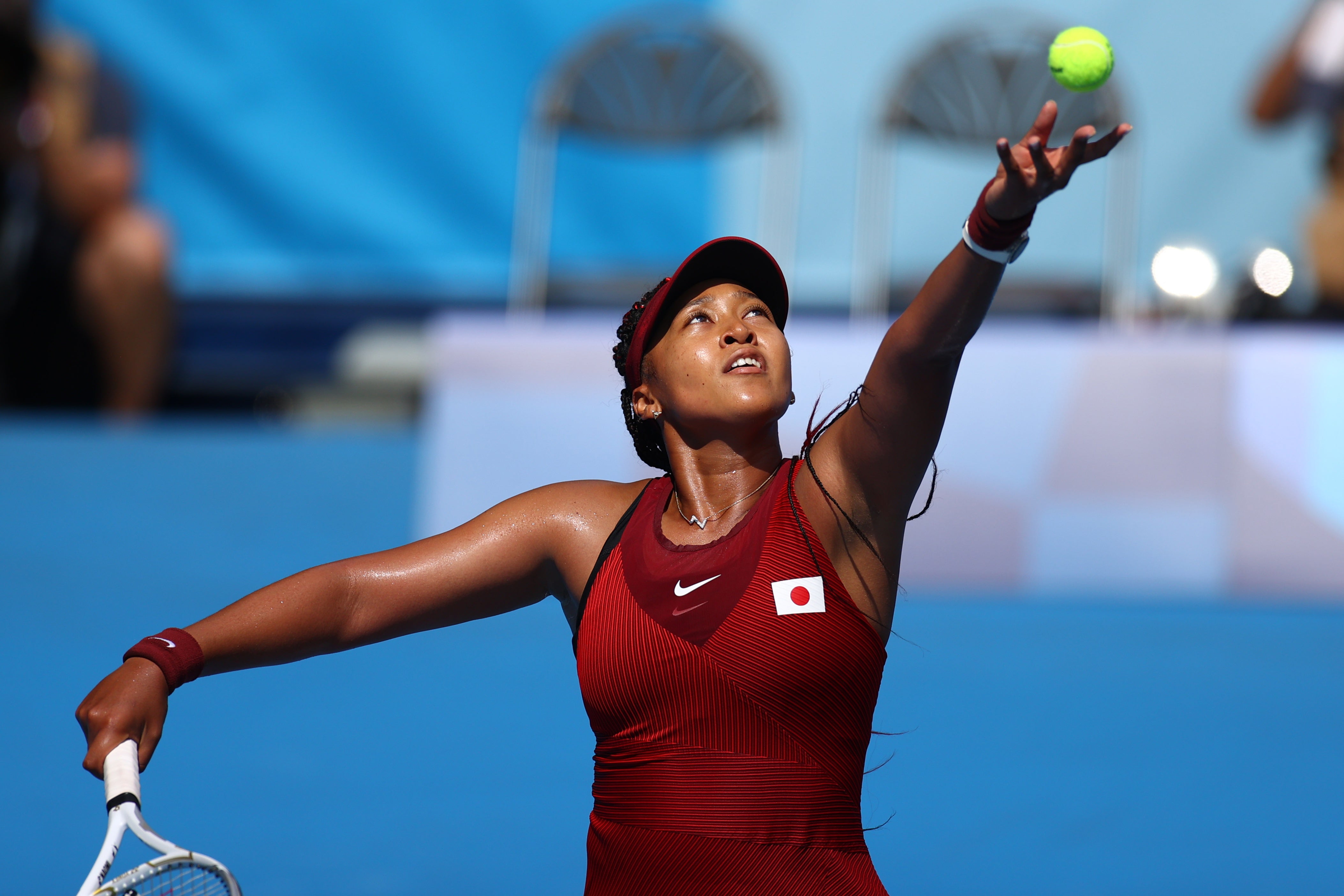 Naomi Osaka serves during Sunday’s first-round match against Zheng Saisai of China