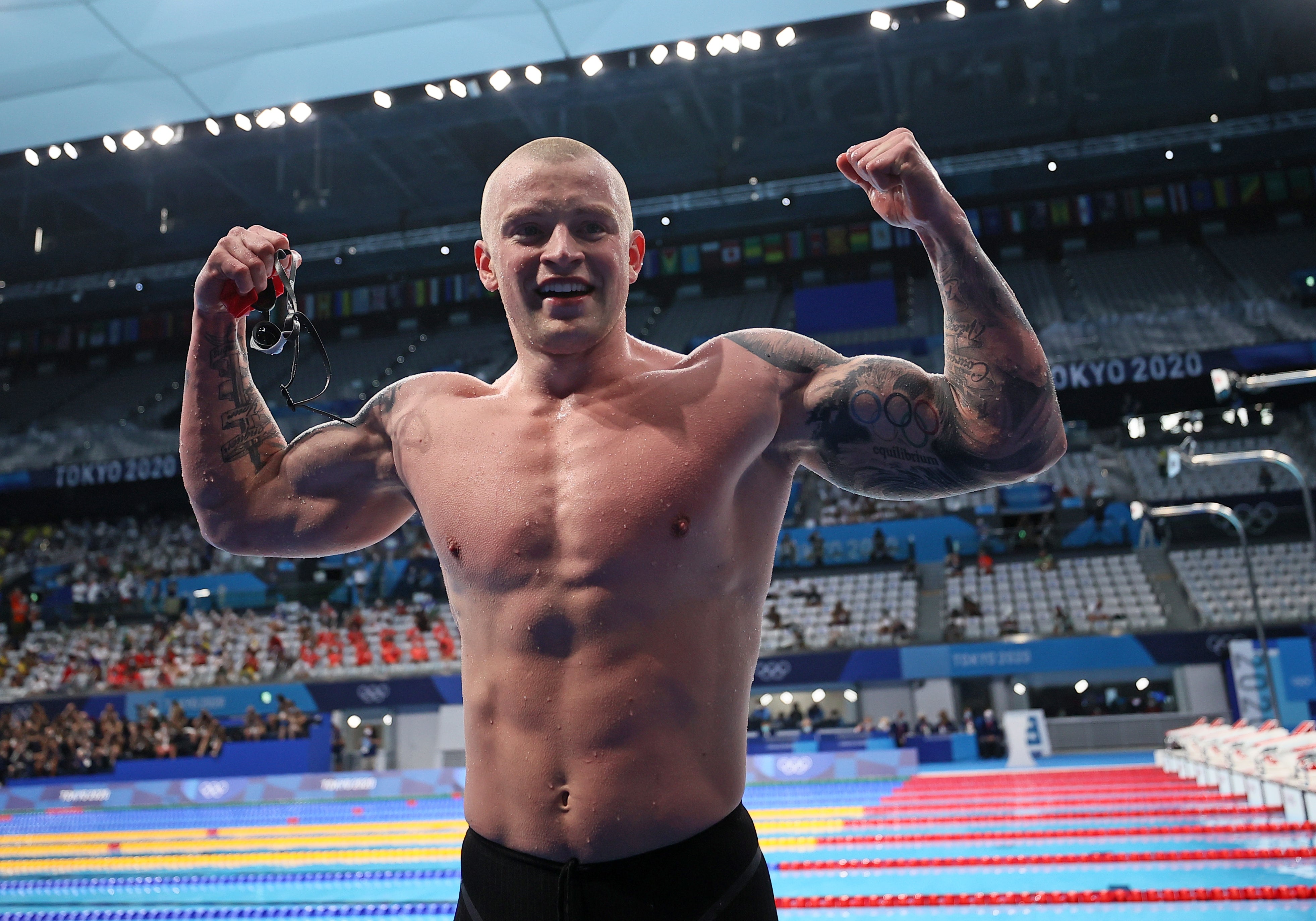 Adam Peaty celebrates winning 100m breaststroke gold