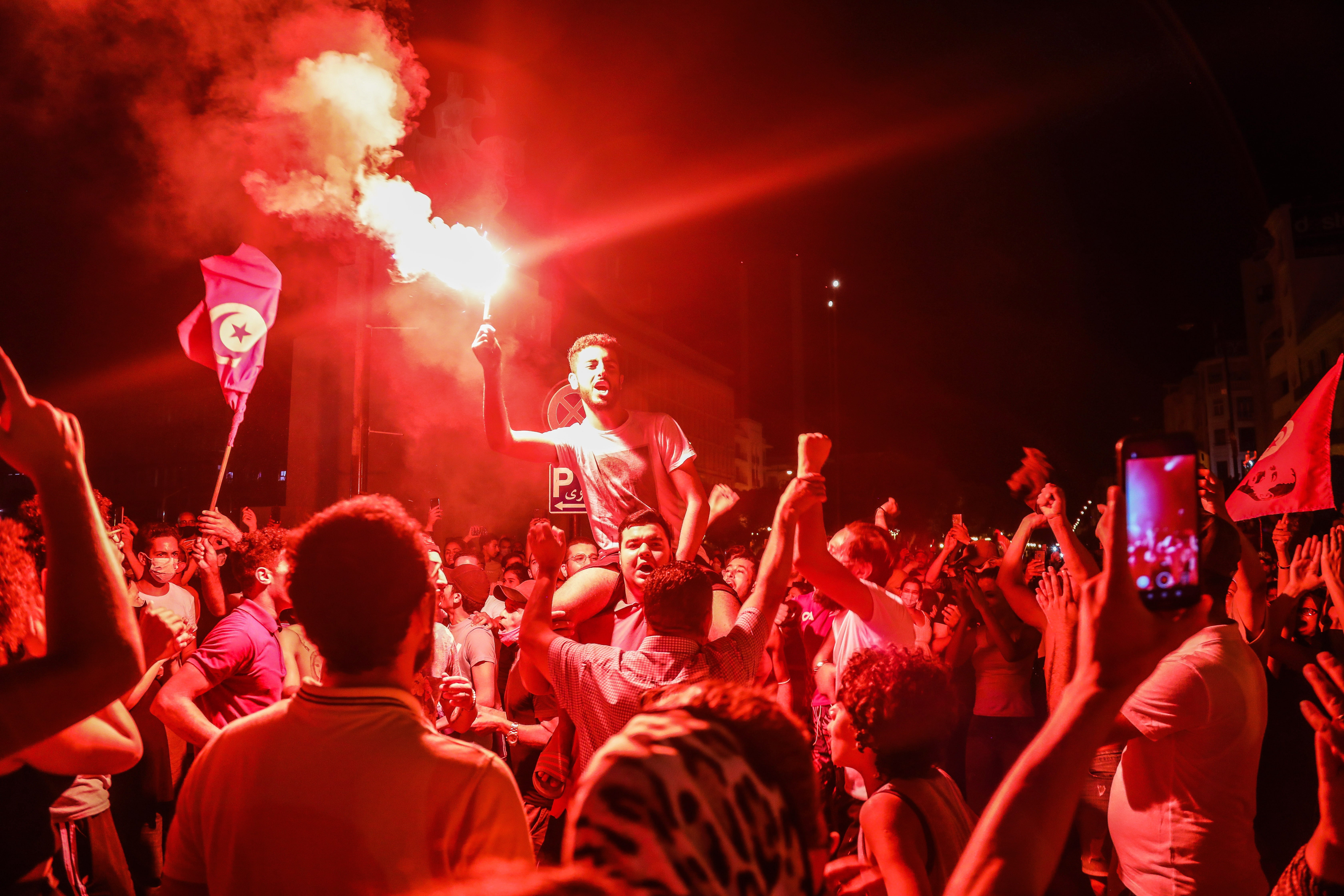 Supporters of Tunisia's President Kais Saied gather on the streets after he dismissed the government and froze parliament, in Tunis