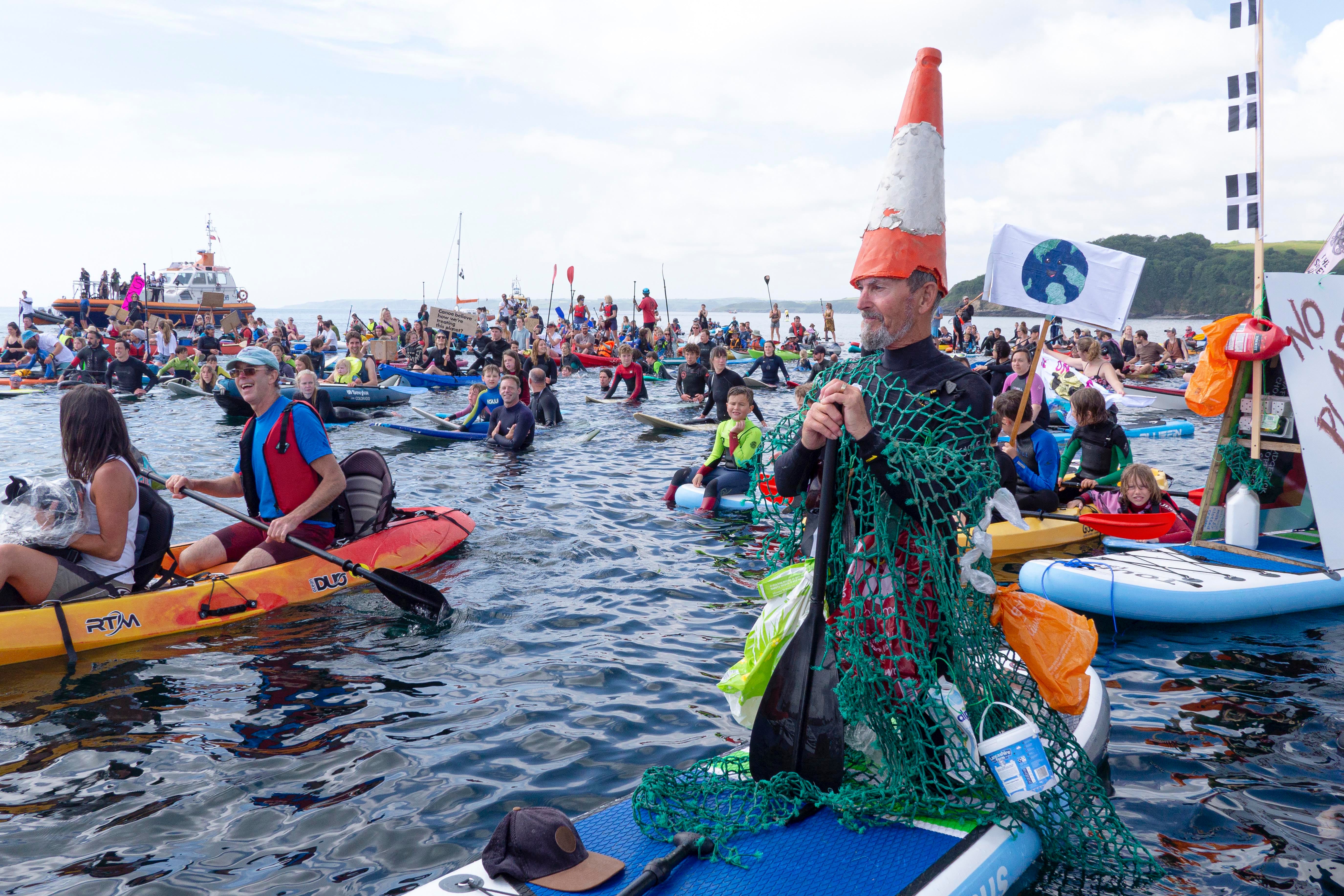 Paddle-out protesters from Surfers Against Sewage gather at Gyllyngvase Beach while Boris Johnson hosts the G7 summit in Cornwall