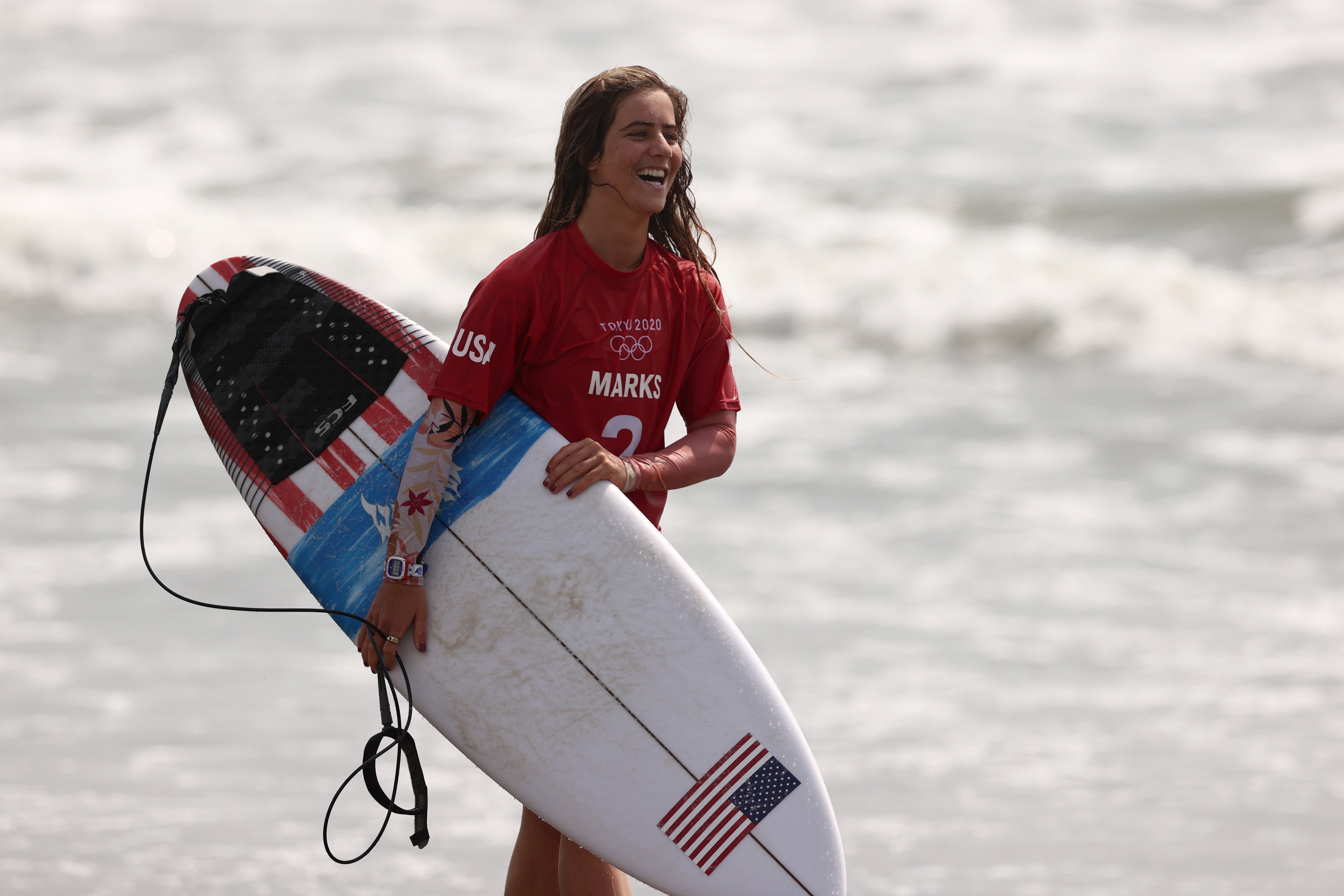 Caroline Marks of Team United States reacts after winning her Women's Round 3 heat against Mahina Maeda of Team Japan on day three of the Tokyo 2020 Olympic Games at Tsurigasaki Surfing Beach on July 26, 2021 in Ichinomiya, Chiba, Japan