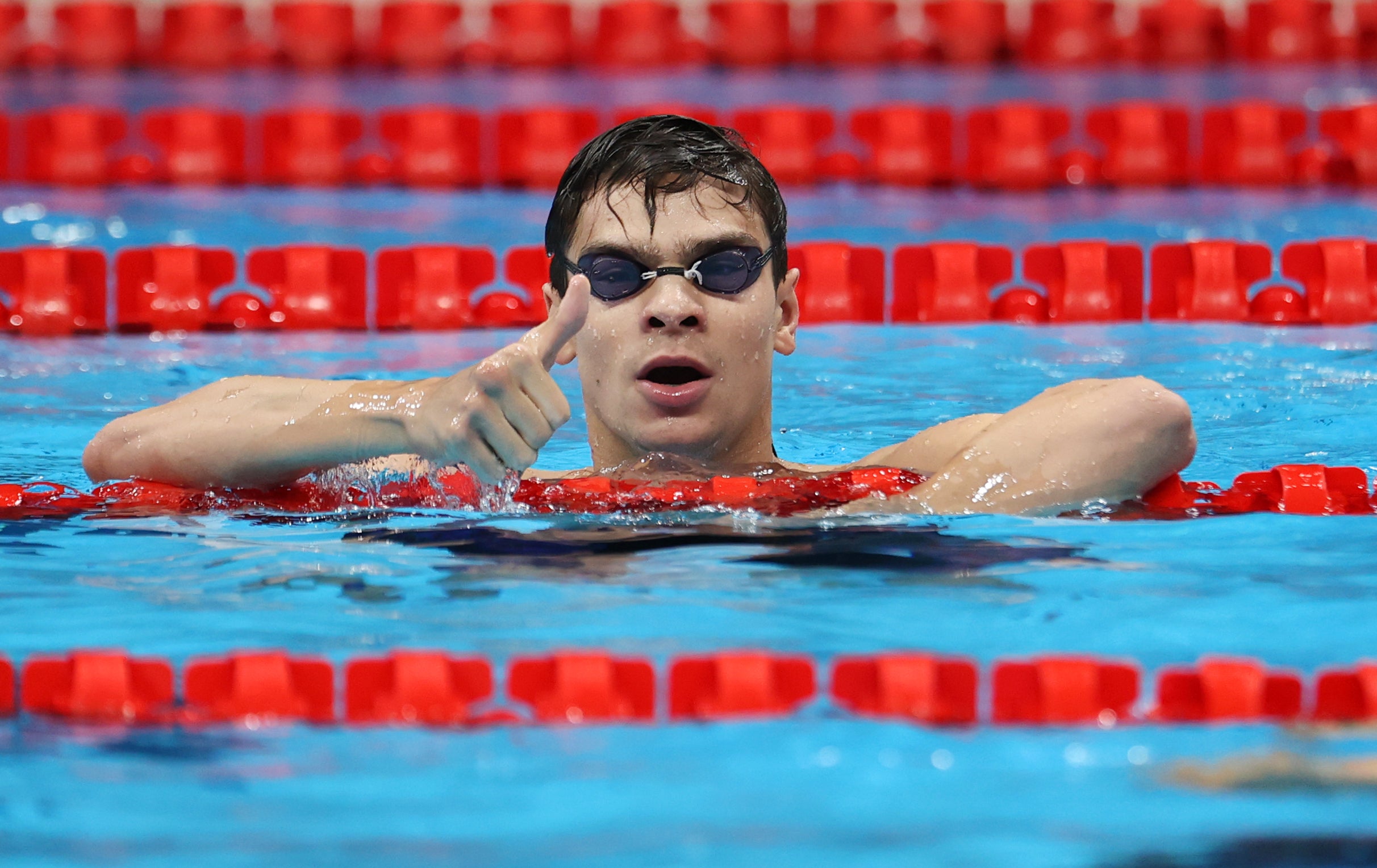 Evgeny Rylov of Team ROC celebrates after winning the gold medal in the Men's 100m Backstroke Final on day four of the Tokyo 2020 Olympic Games at Tokyo Aquatics Centre on 27 July 2021 in Tokyo, Japan