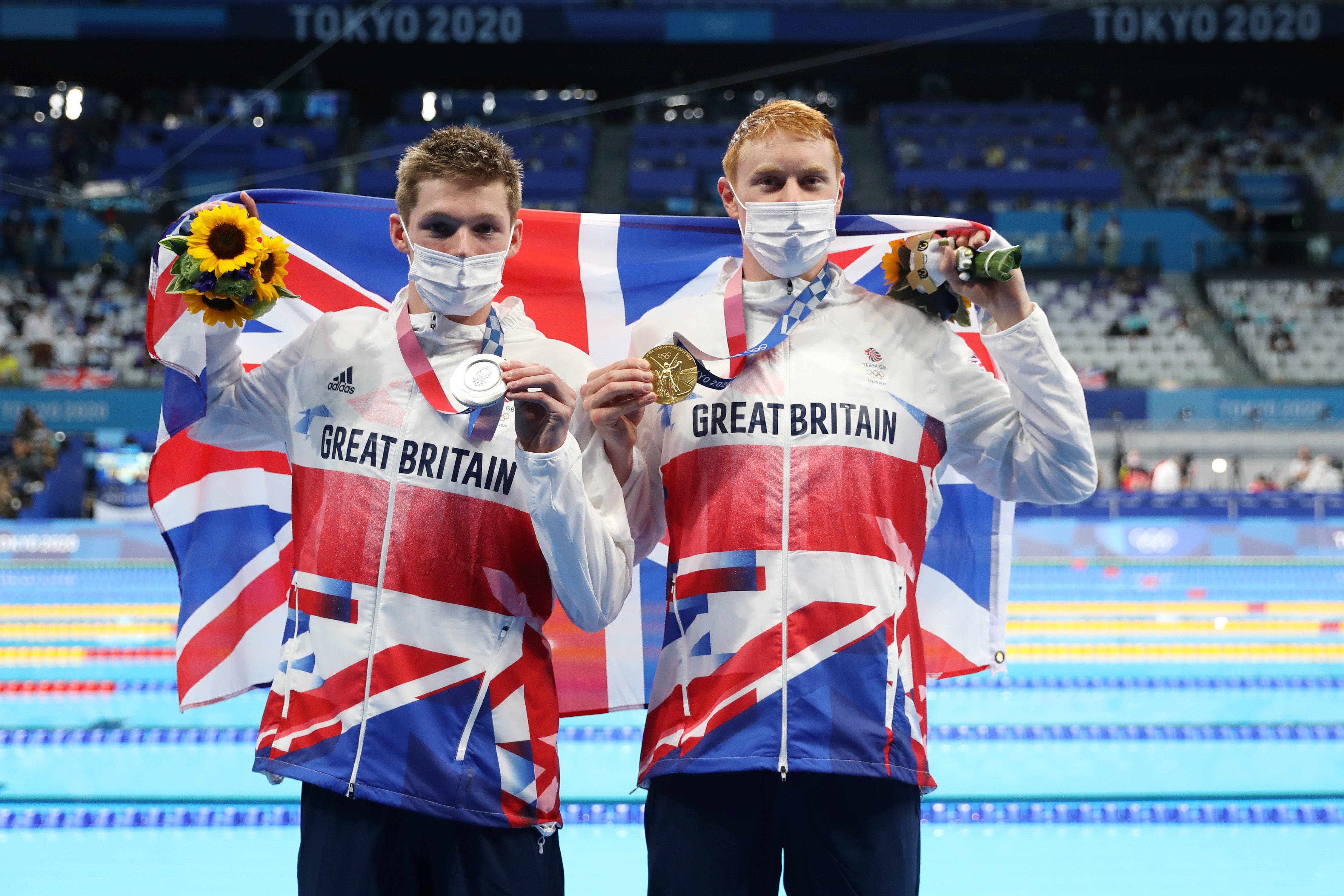 Silver medalist Duncan Scott of Team Great Britain and gold medalist Tom Dean of Team Great Britain pose with their medals for the Men's 200m Freestyle Final on day four of the Tokyo 2020 Olympic Games at Tokyo Aquatics Centre on 27 July 2021 in Tokyo, Japan