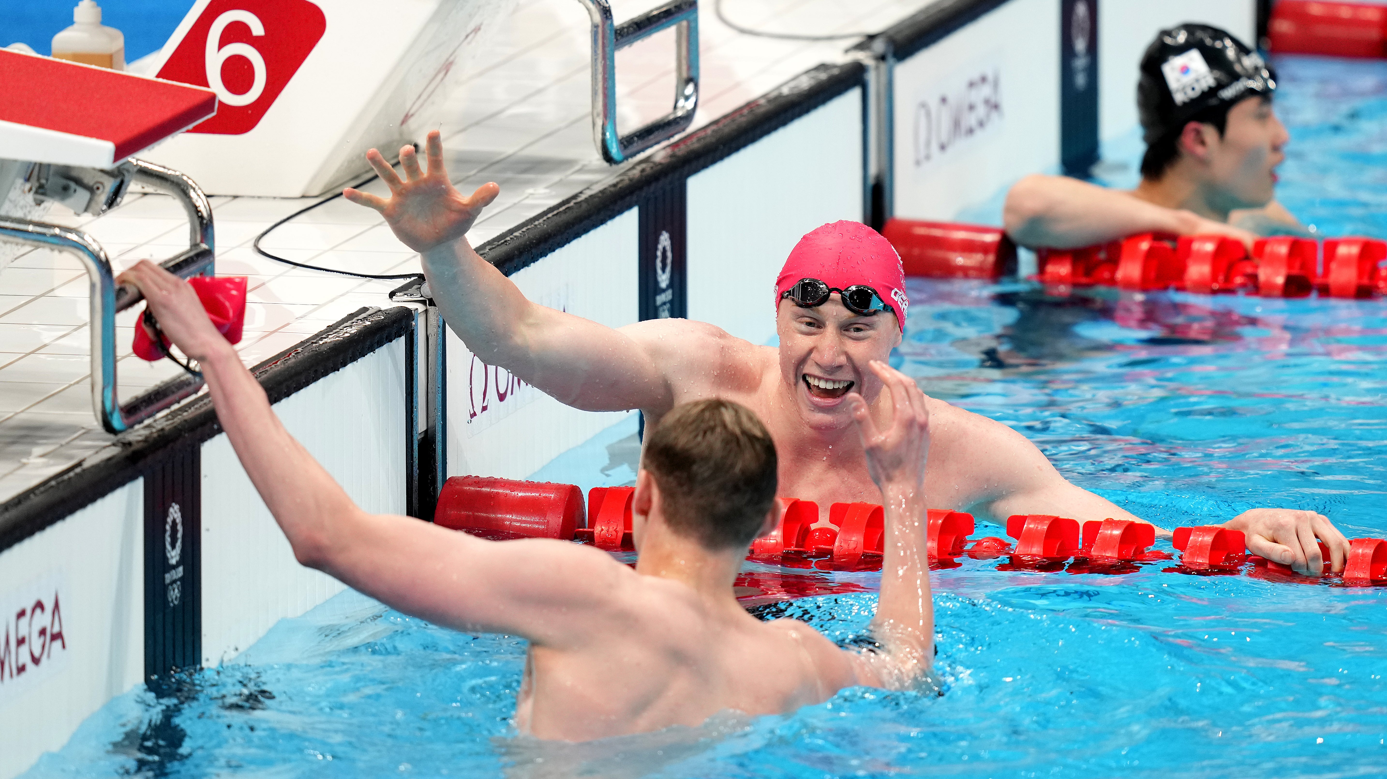 Tom Dean and Duncan Scott celebrate (Joe Giddens/PA)