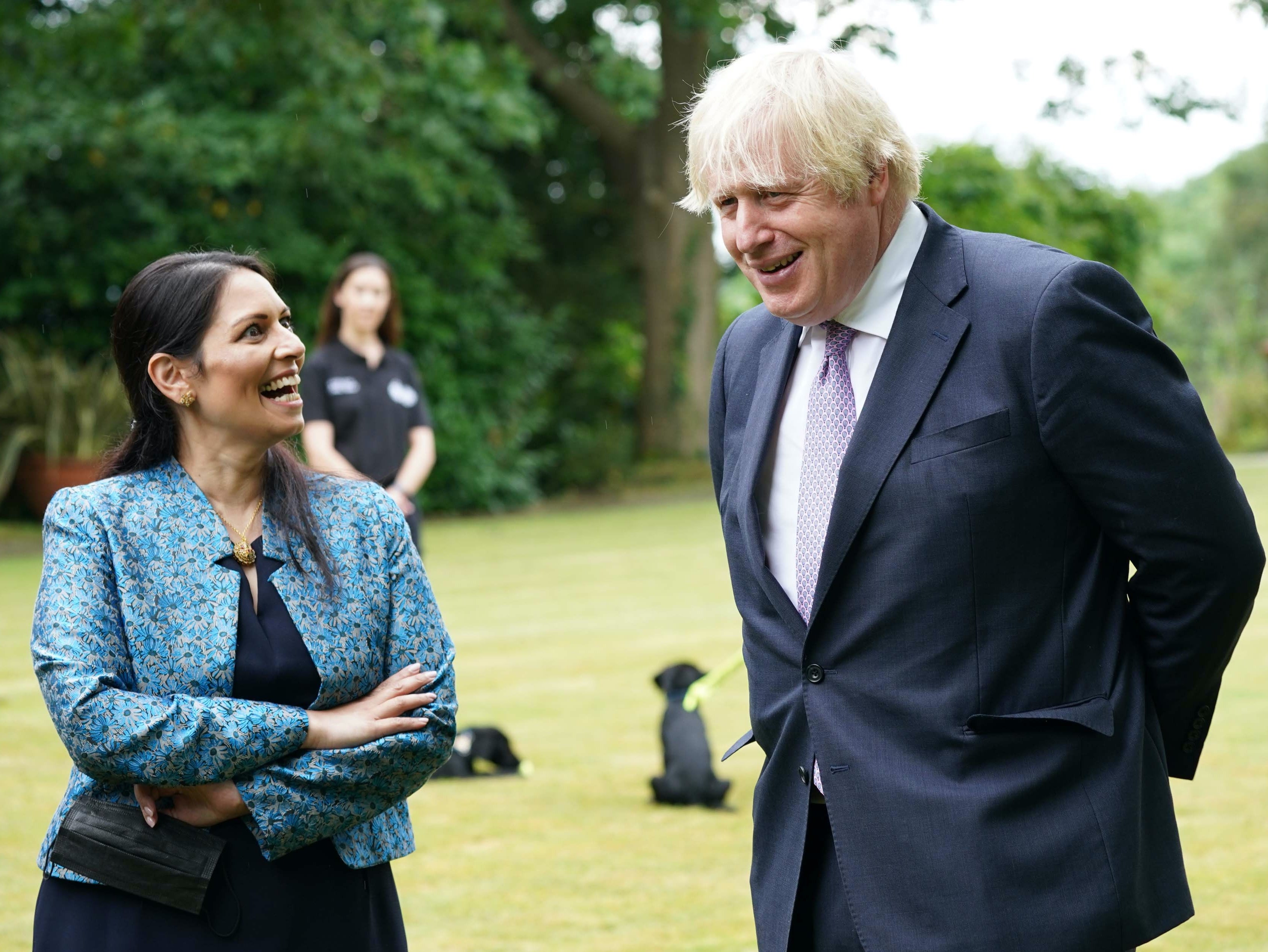 Boris Johnson and home secretary Priti Patel at Surrey Police headquarters in Guildford