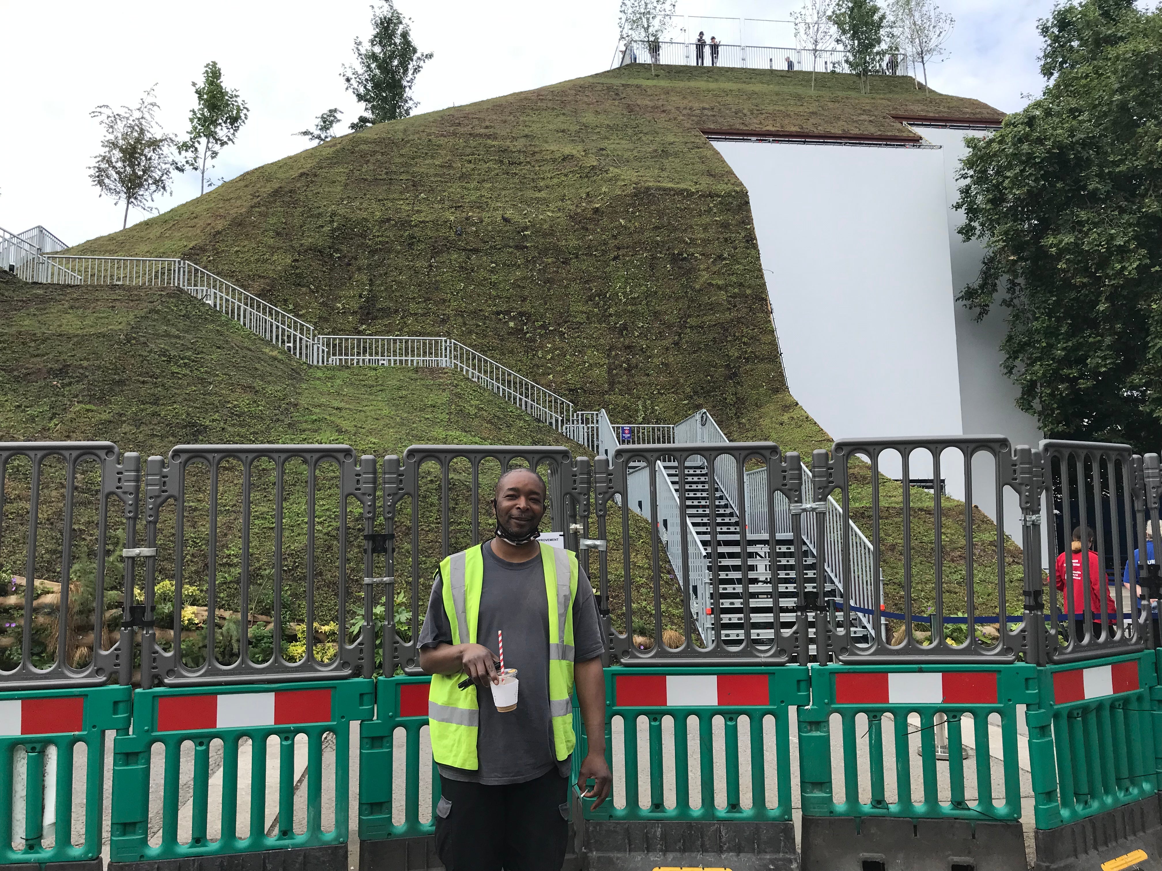 Scaffolder Mo Martins stands in front of Marble Arch Mound.