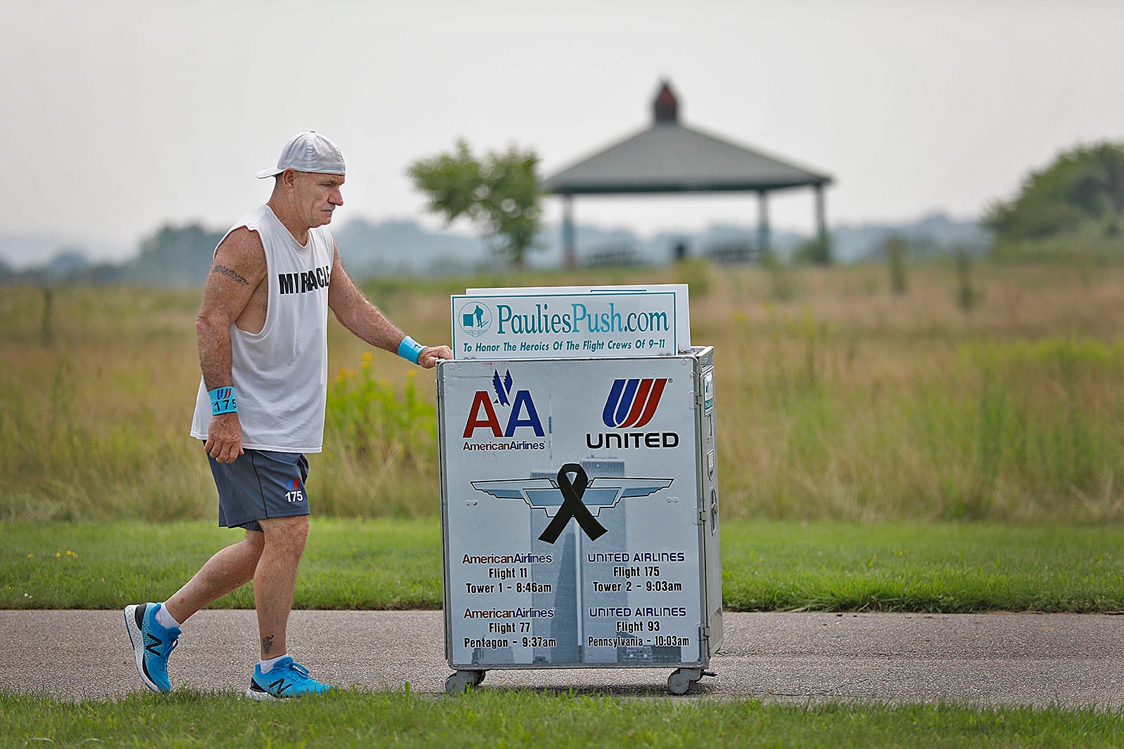 Paul Veneto of Braintree, Massachusetts, pushes an airline service cart in Boston. Veneto, a former flight attendant who lost several colleagues when United Flight 175 was flown into the World Trade Center on September 11, is honoring his friends this year by pushing his cart along the American Flight 11 route from Boston to New York City