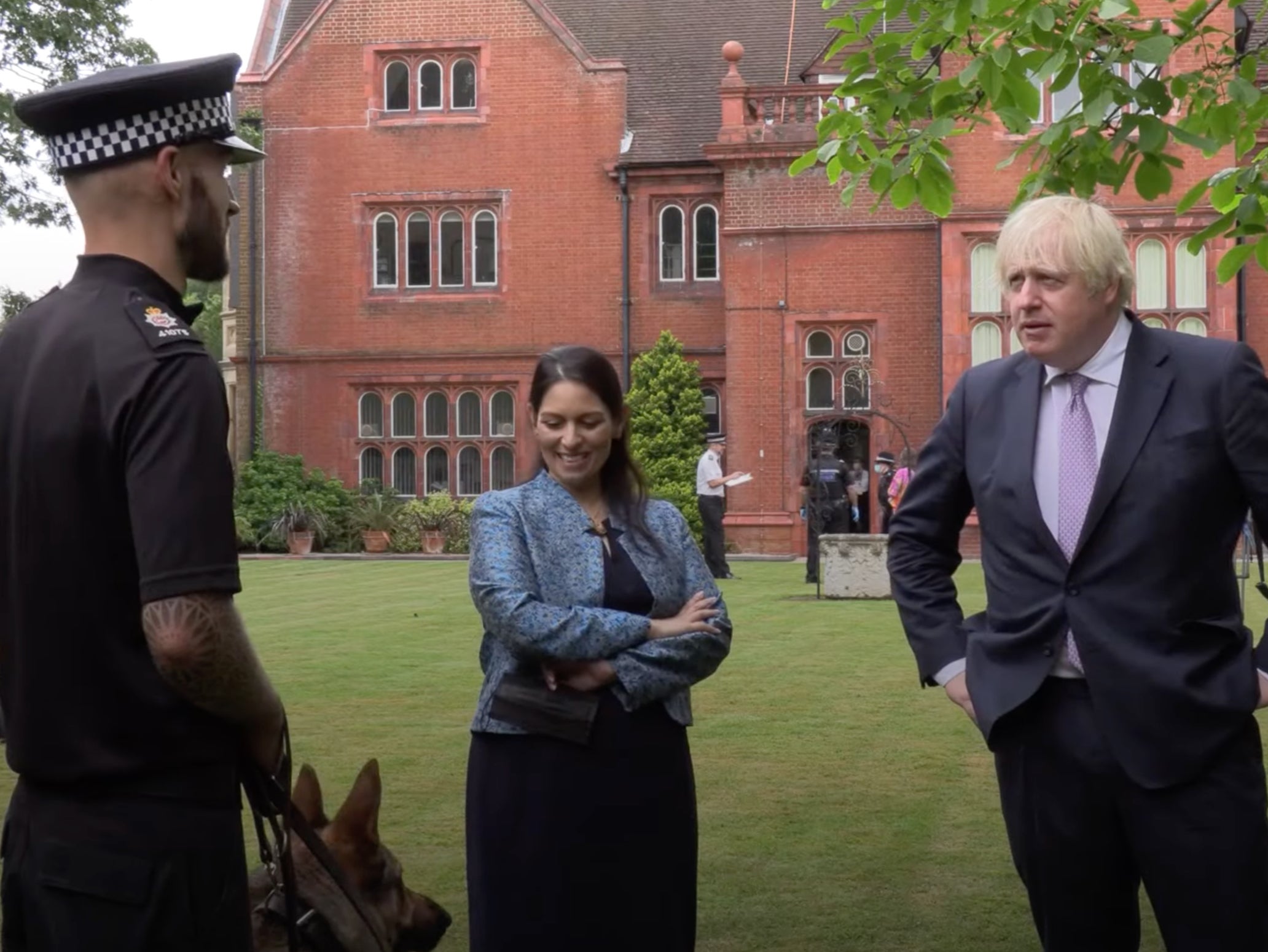 The prime minister and home secretary on a visit to Surrey Police HQ