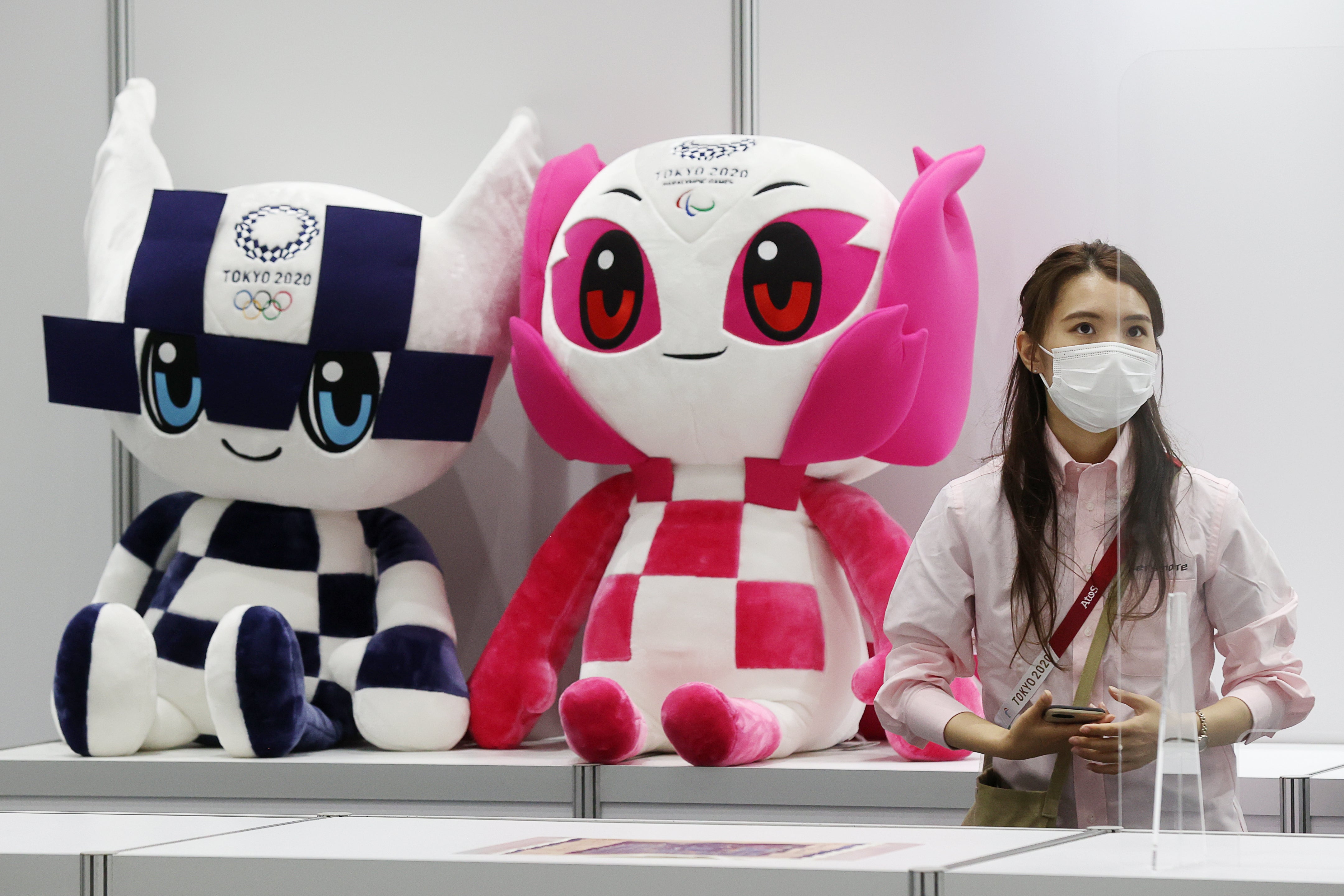 Miraitowa and Someity, the mascots of the Olympic and Paralympic Games on display at the Main Press Centre of the 2020 Summer Olympics