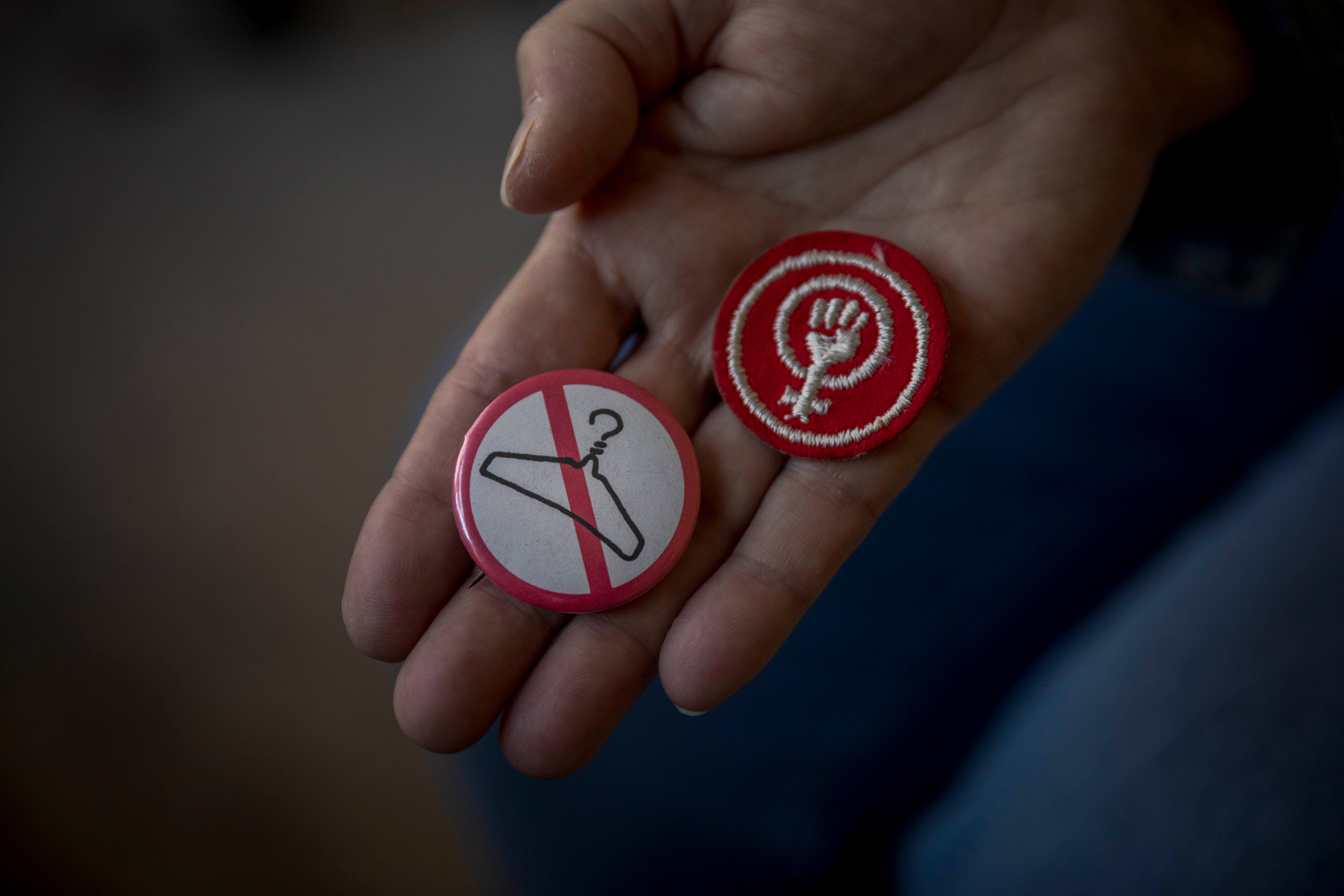 Retired Atlanta-based social worker Sharon Wood holds a pro-choice pin which she last wore in 1973