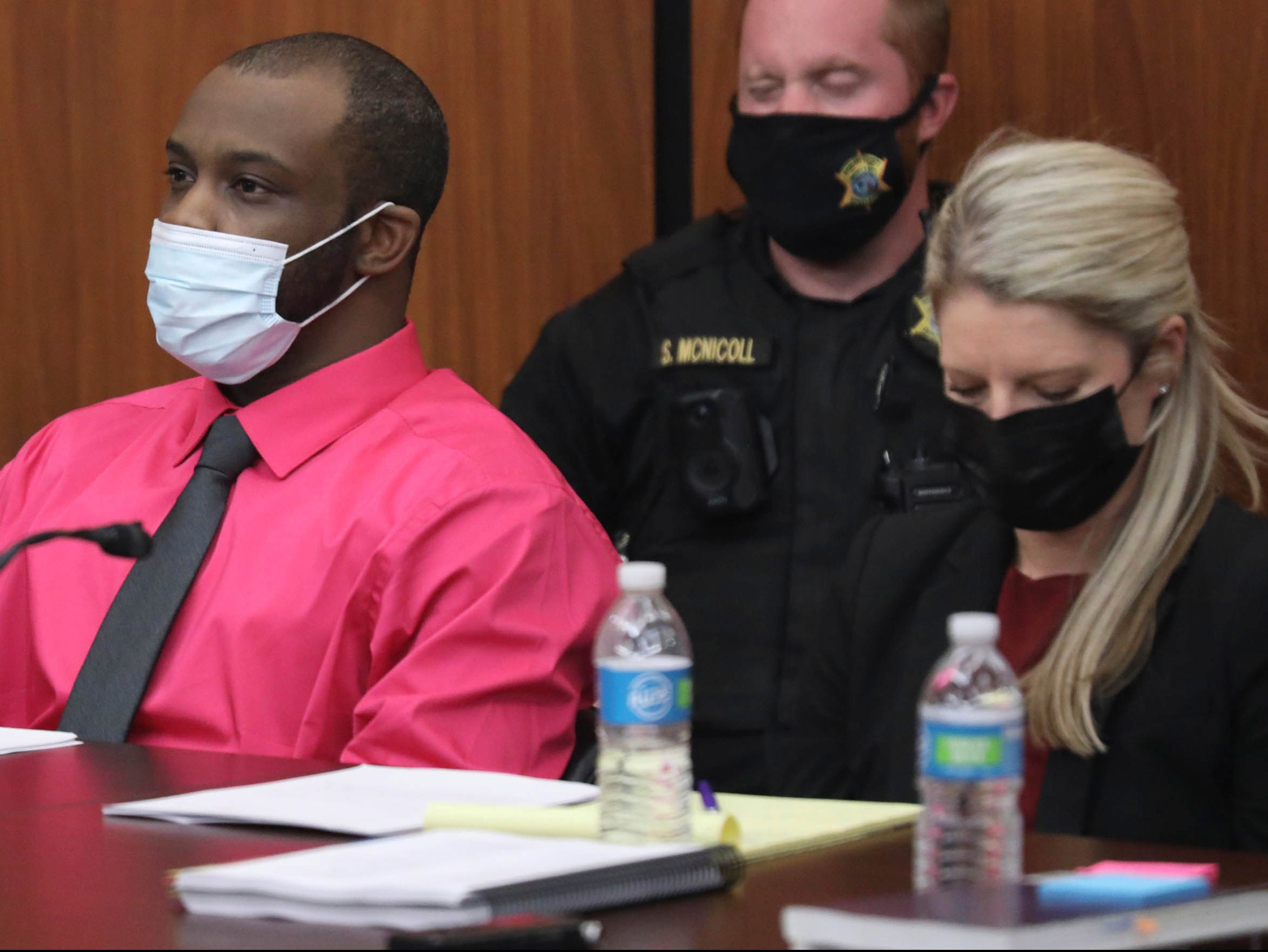 Defendant Nathaniel Rowland sits with his attorney Alicia Goode during closing arguments in his trial on Tuesday 27 July 2021