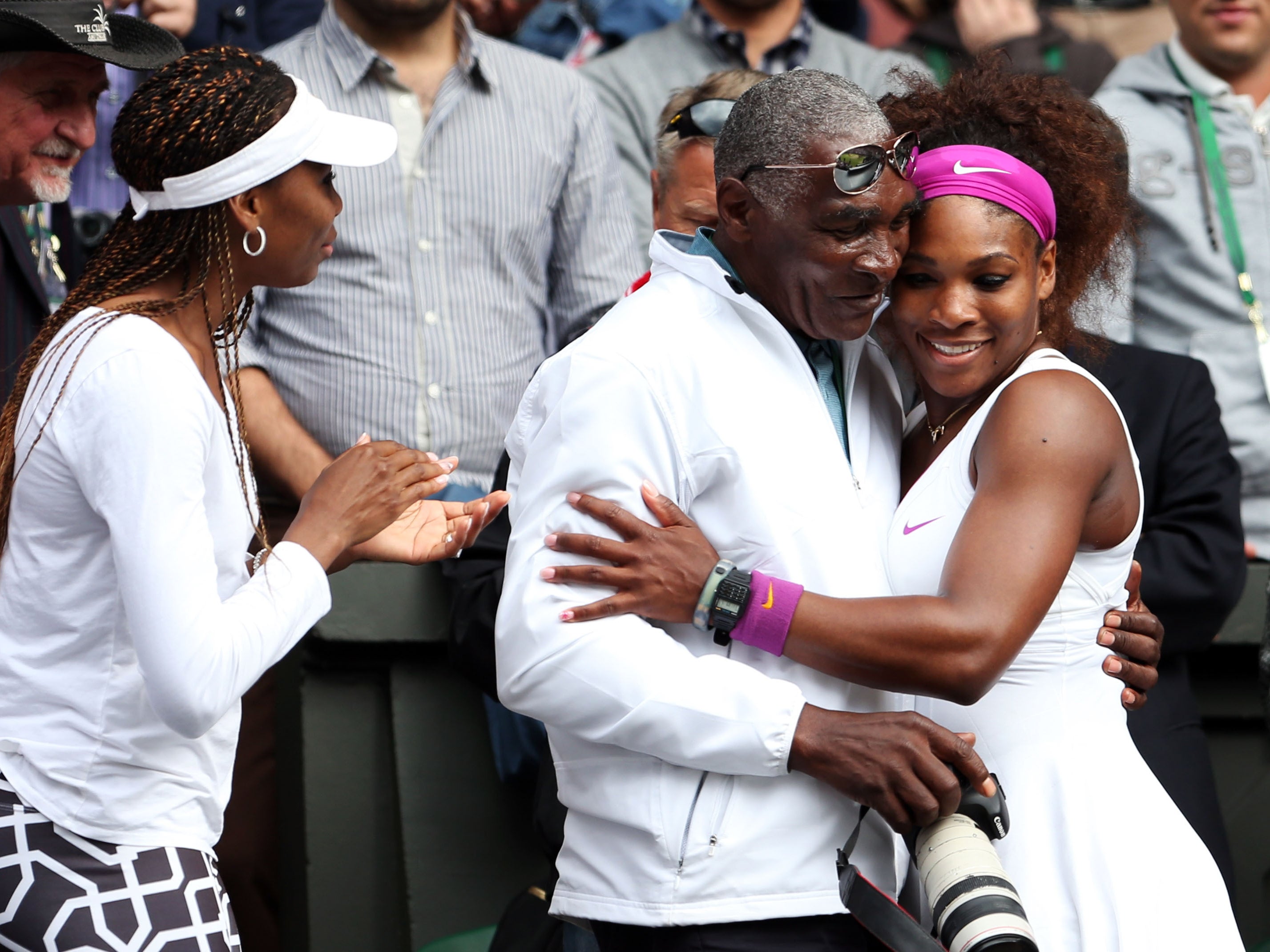 The real Venus, Serena and Richard (from L-R) celebrating after the Ladies’ Singles final match against Agnieszka Radwanska of Poland on day twelve of the Wimbledon Lawn Tennis Championships at the All England Lawn Tennis and Croquet Club on July 7, 2012